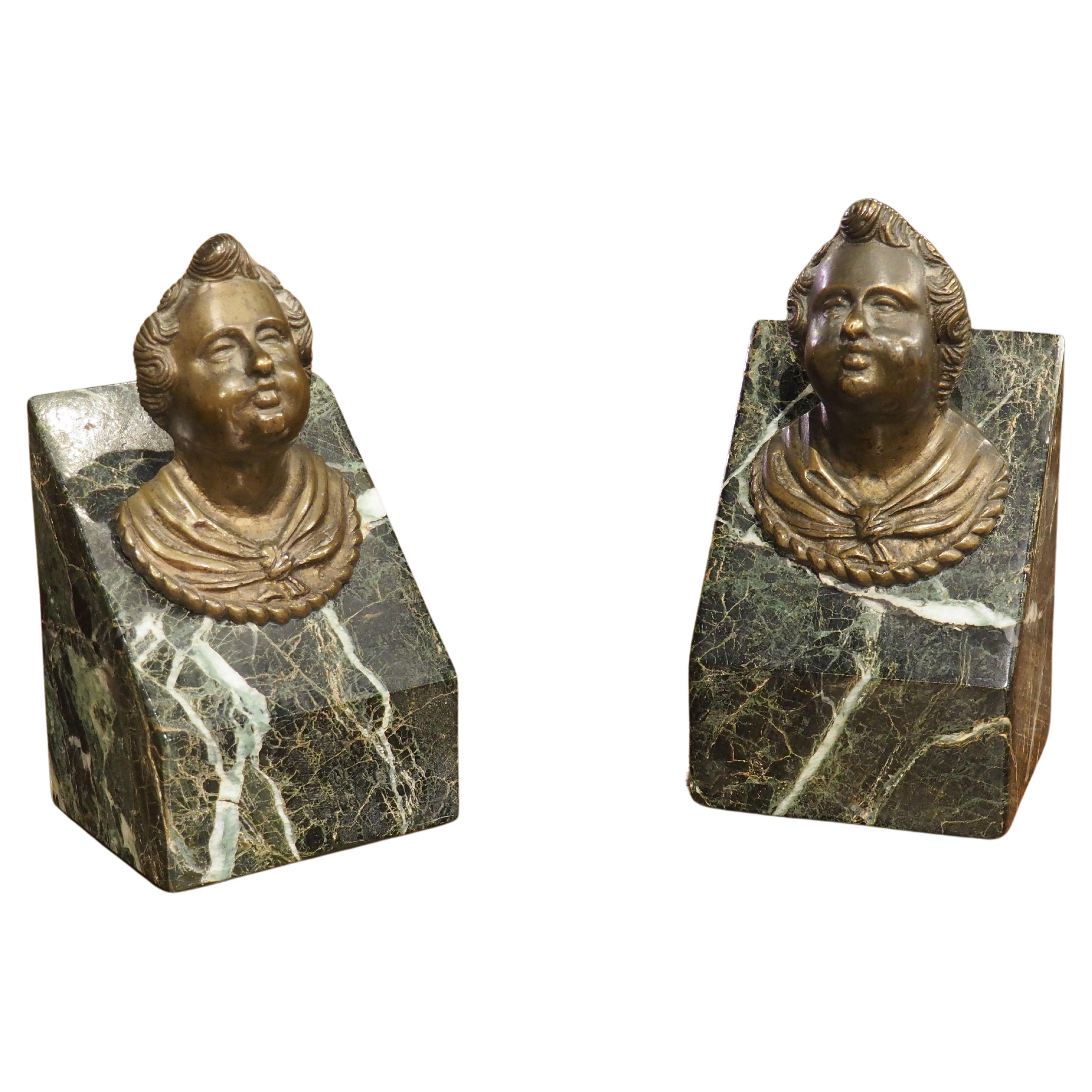 Pair of French Patinated Bronze Putti Heads On Sea Green Marble Plinths, C. 1700