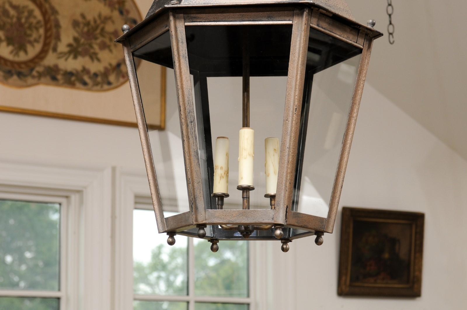Pair of French Patinated Metal Three-Light Lanterns with Glass Panels, US Wired 1