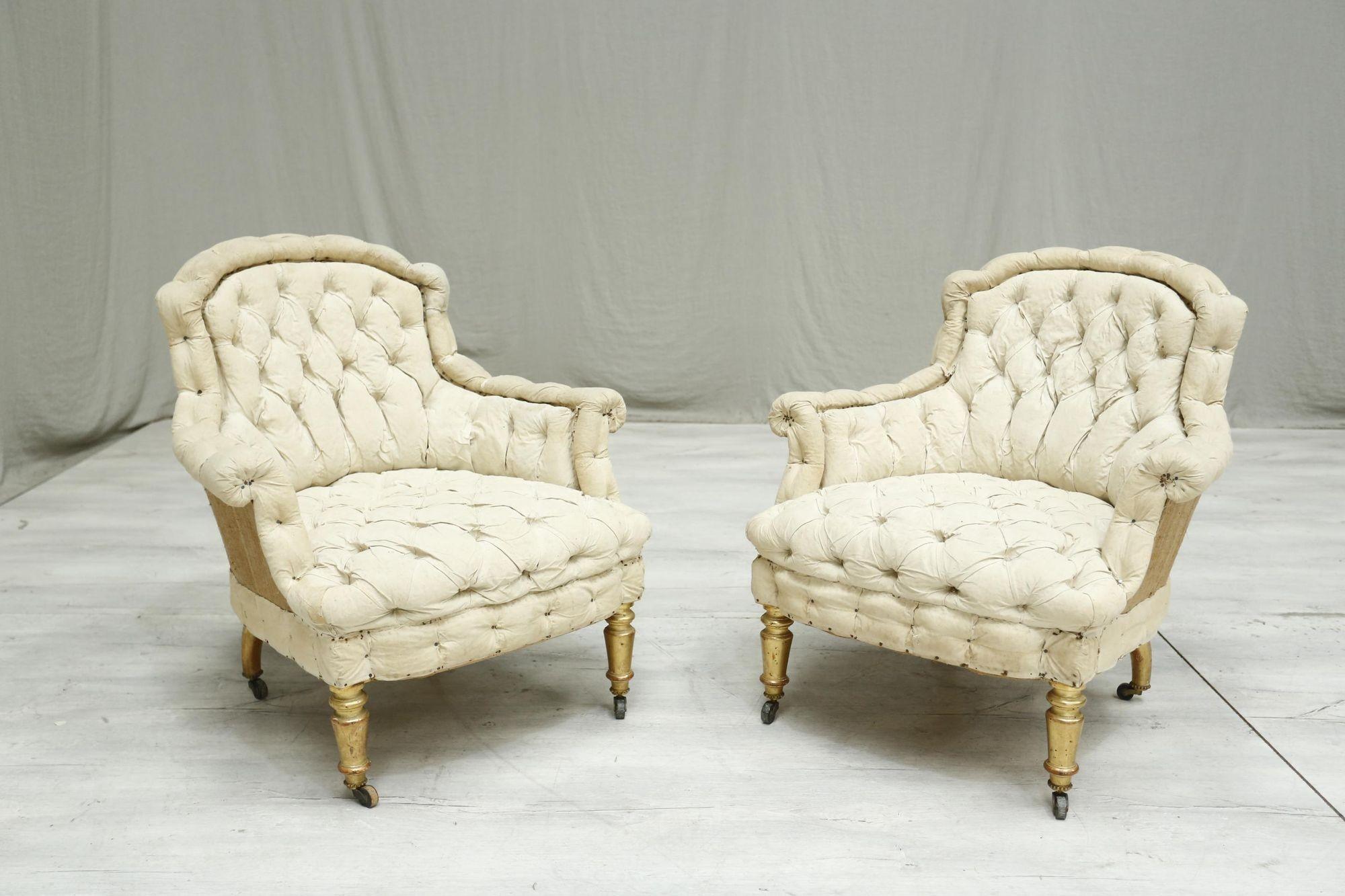 These are a superb quality pair of 19th century French armchairs. The deep buttoned details with the piecrust edge is a great combination and when these are upholstered they will be a very inviting pair of chairs. Combine that with the original gilt