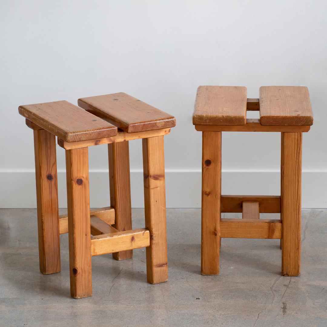 Great pair of French square stool in the style of Charlotte Perriand's Les Arc designs. Pine wood with original finish and great age and wear. Priced as a pair.