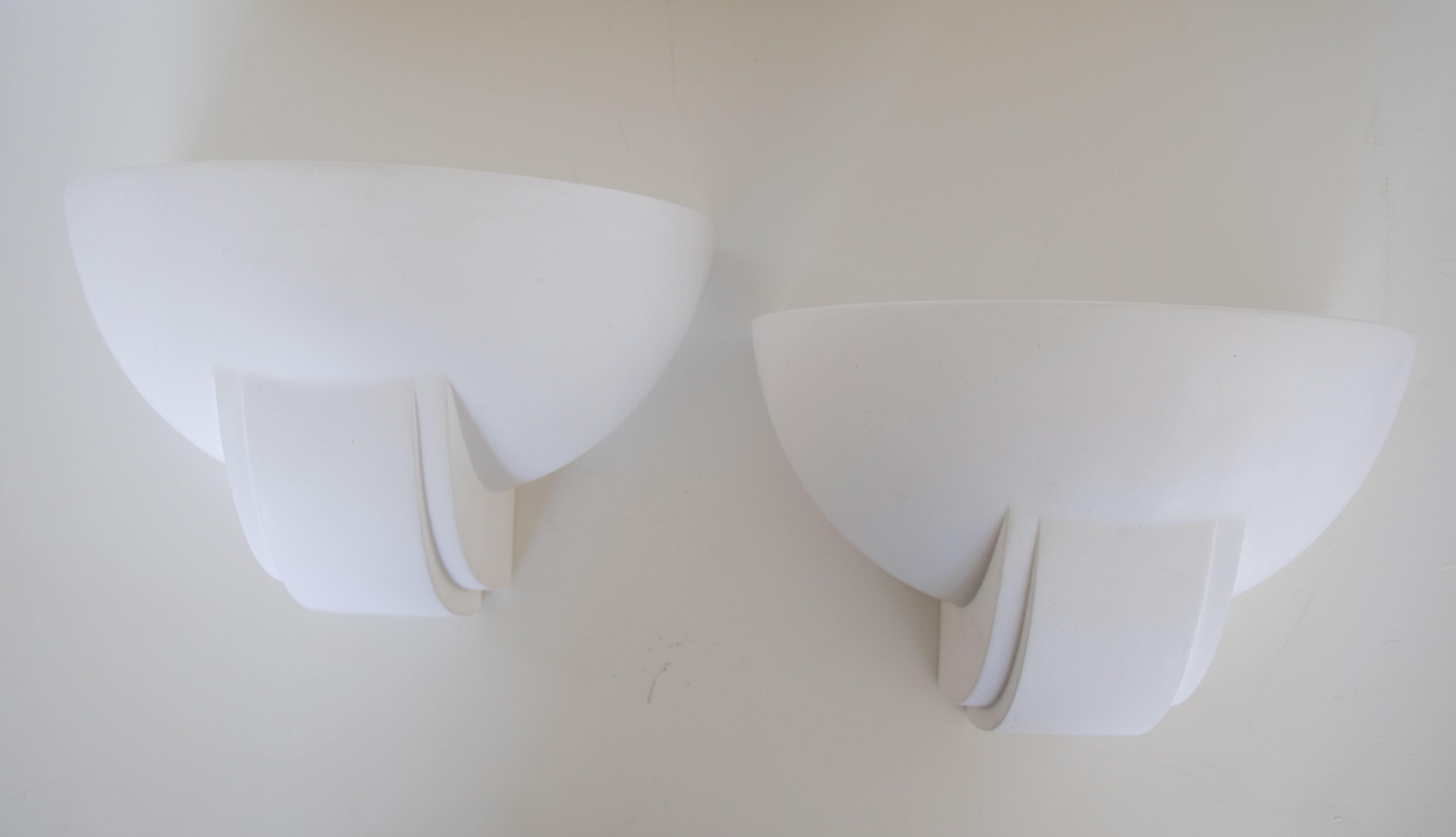 Beautiful pair of half dome shaped sconces in white plaster. Newly re-wired with single interior light in each. Plaster is original showing slight signs of age and wear. 
  