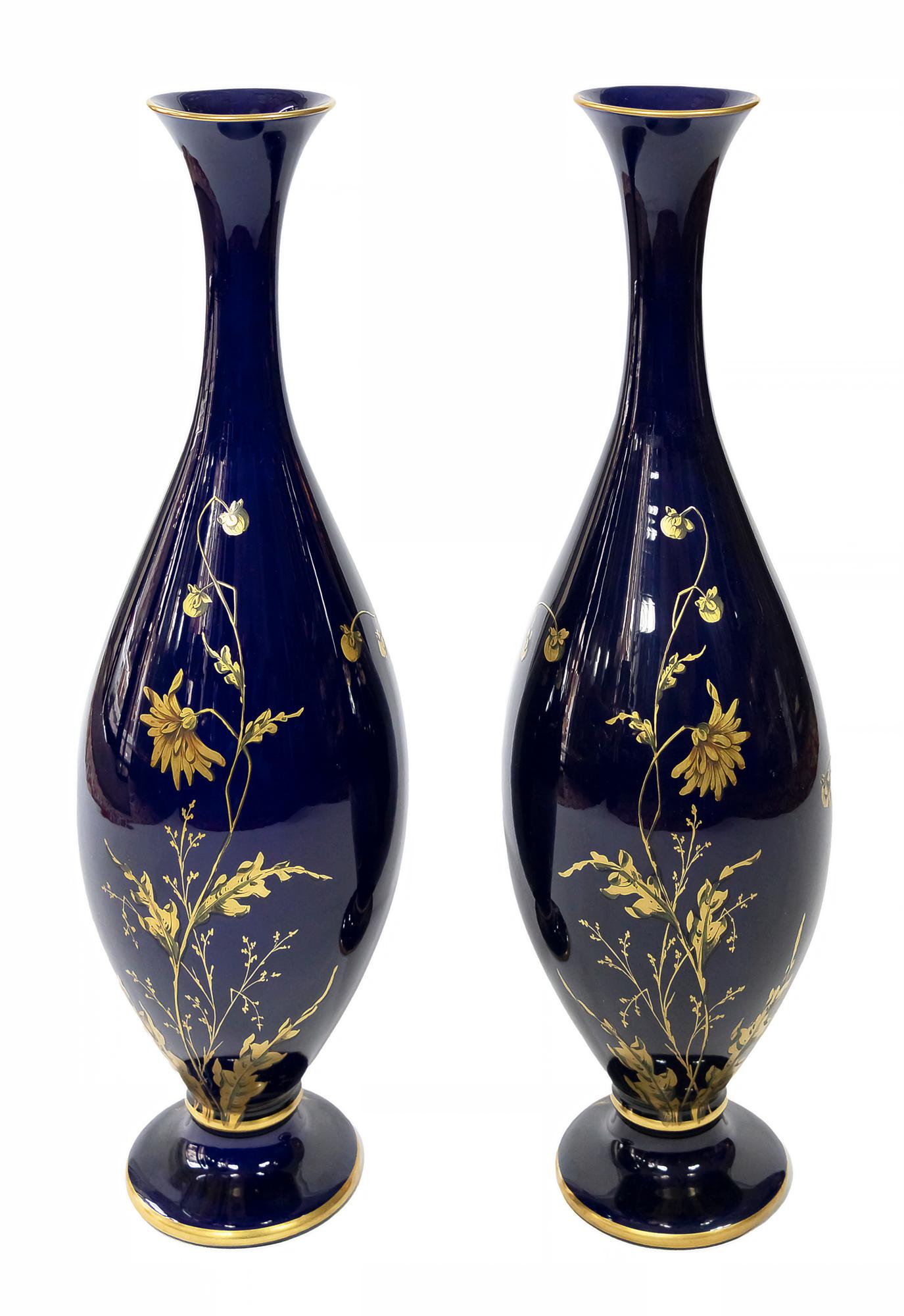 Pair of French glazed porcelain cobalt blue vases decorated with floral decor in gold.
Probably created by Gustave Asch and made by Sainte Radegonde.