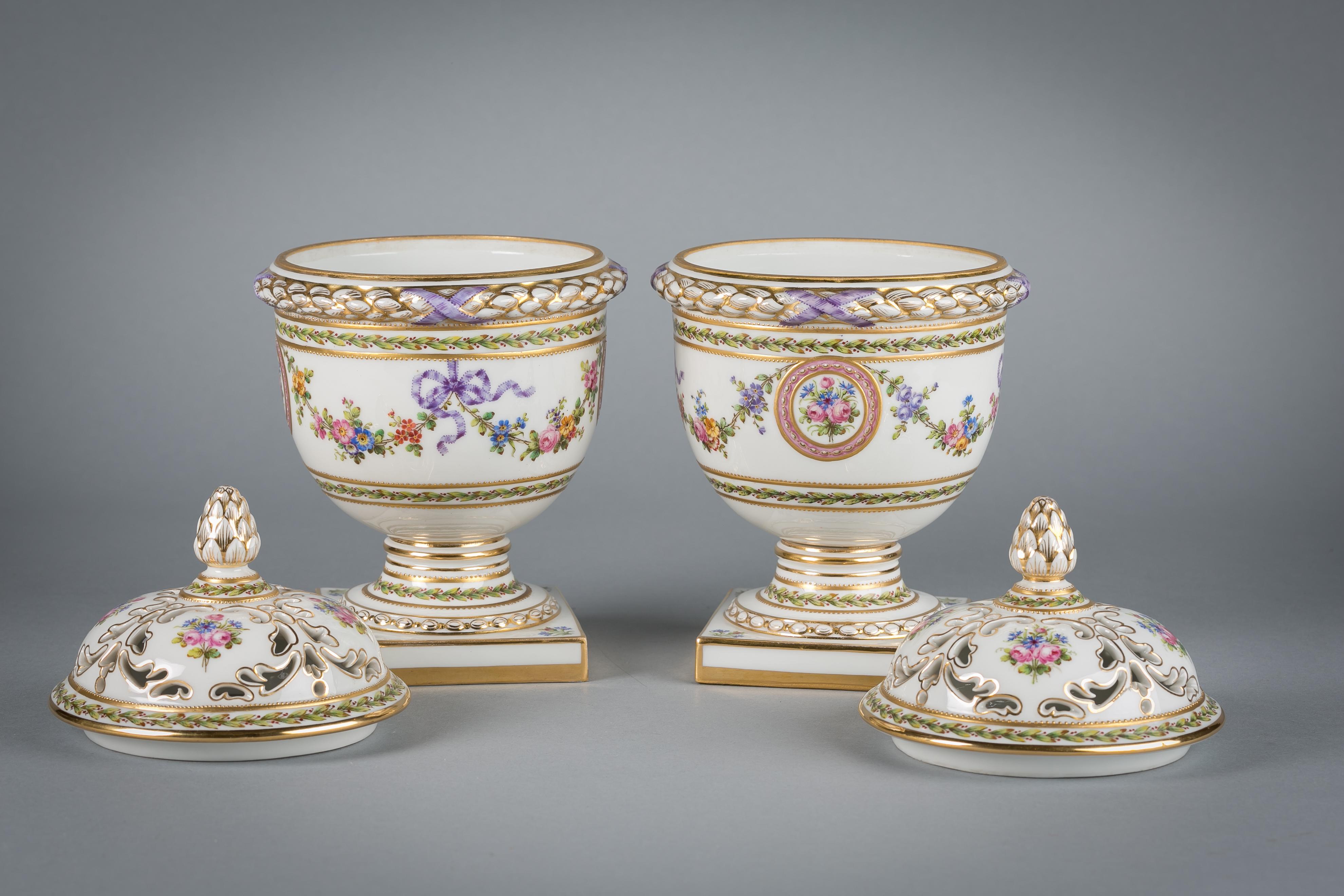 Pair of French porcelain covered potpourri covered jars, circa 1890.
