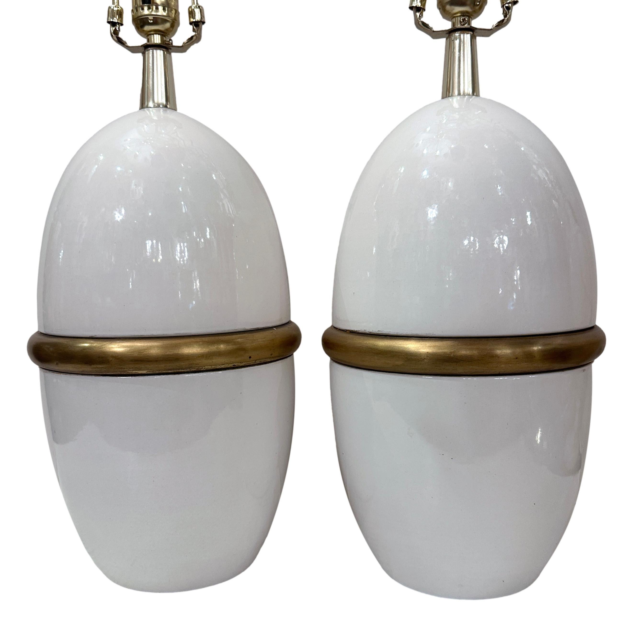 Pair of circa 1960's French white porcelain lamps.

Measurements:
Height of body: 16