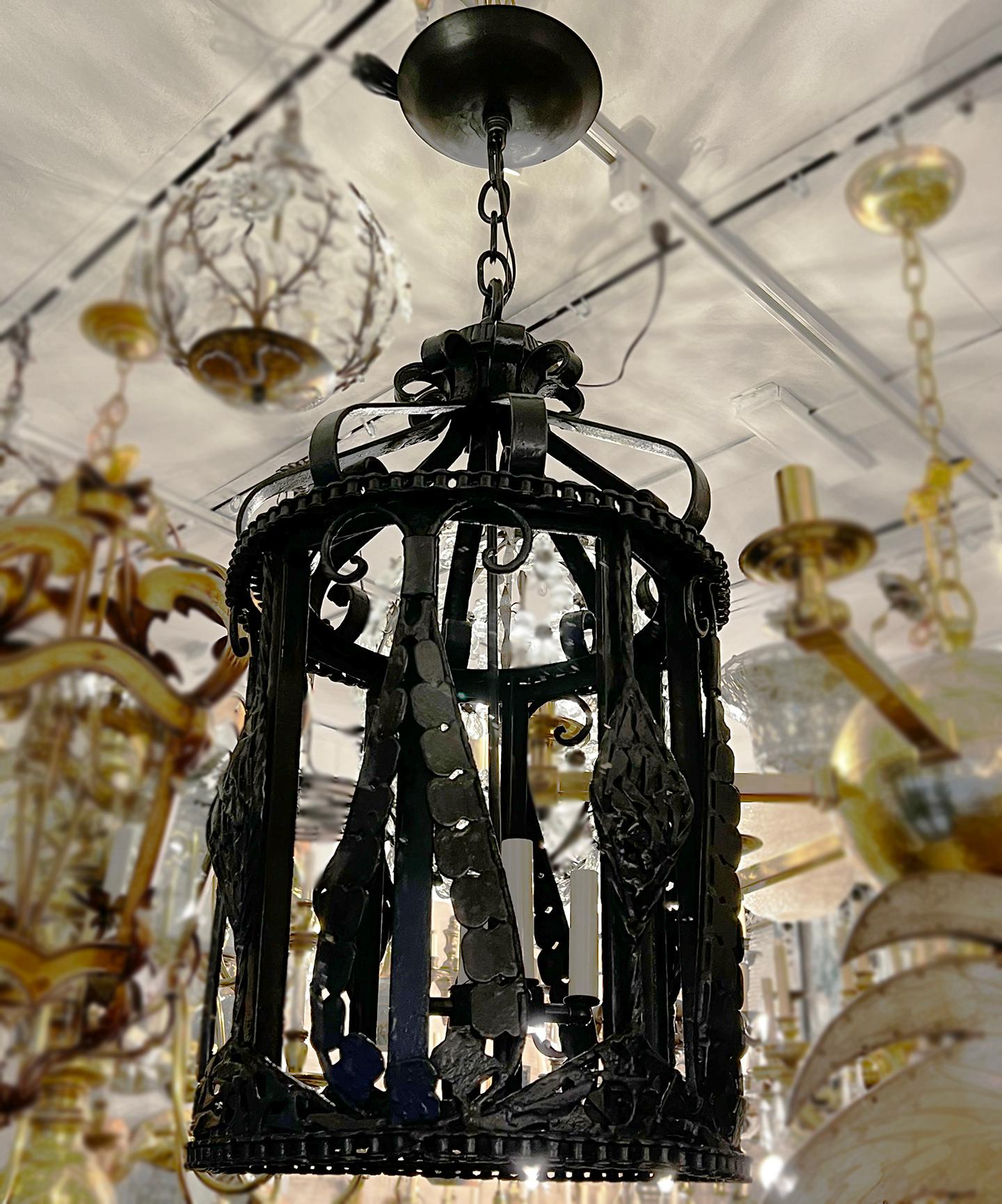 A circa 1920 French wrought iron lantern with 4 lights. Sold individually.

Measurements:
Min. Drop: 33