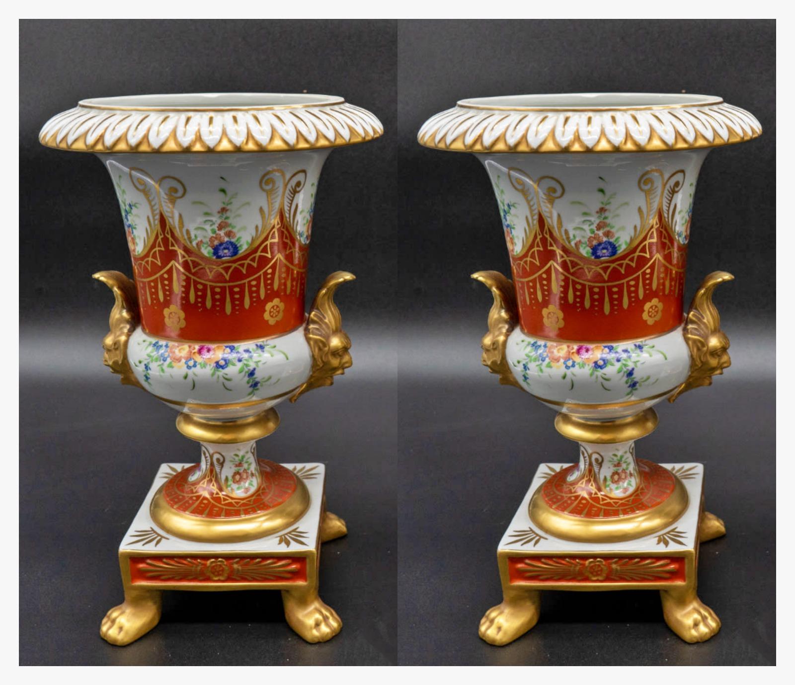 Pair of French Porcelain vases end 19th century/early 20th century
French, marked on the base, mouthpiece with relief decoration of leaves on a bulging body supported by a square base with four gilded feet, with side handles representing gilded