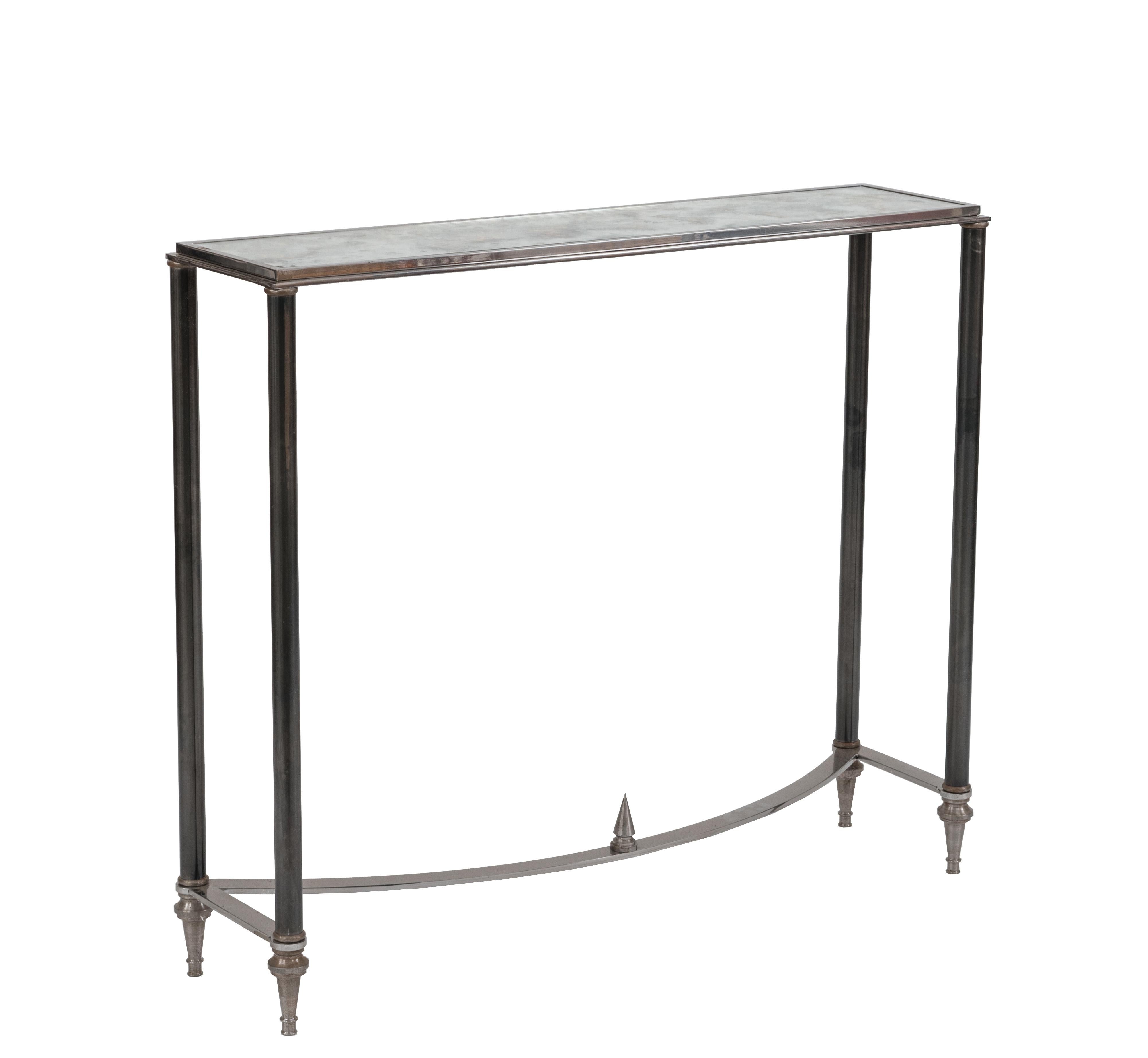 Pair of French (1960s-1970s) post-war design console tables in gun metal and brass trim with a semi-circular stretcher & verre églomisé glass top. (stamped: MAISON JANSEN).


Maison Jansen was a Paris-based interior decoration office founded in