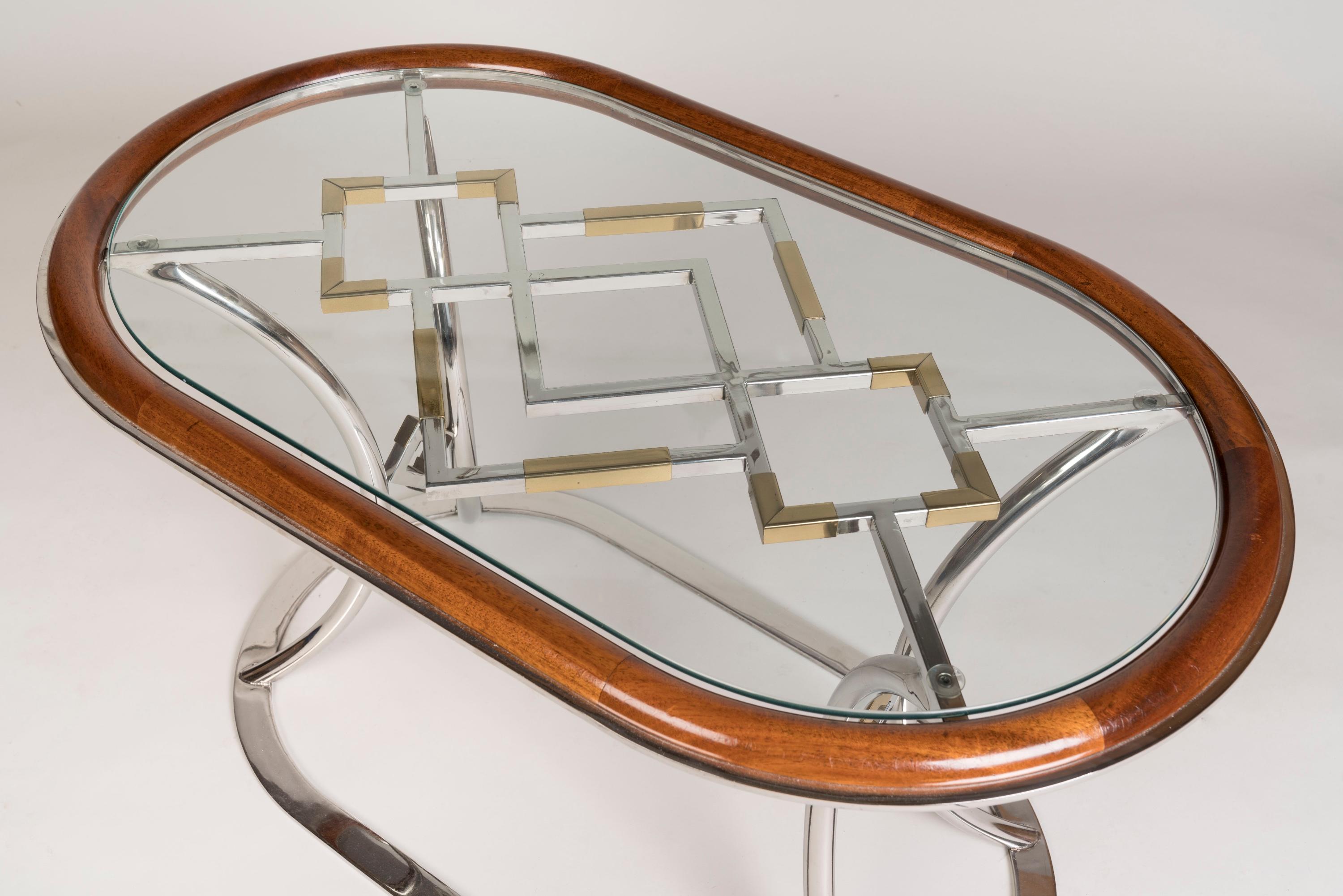 Brass Pair of French Post-War Modernist Oval Coffee Tables attributed to Maison Jansen For Sale