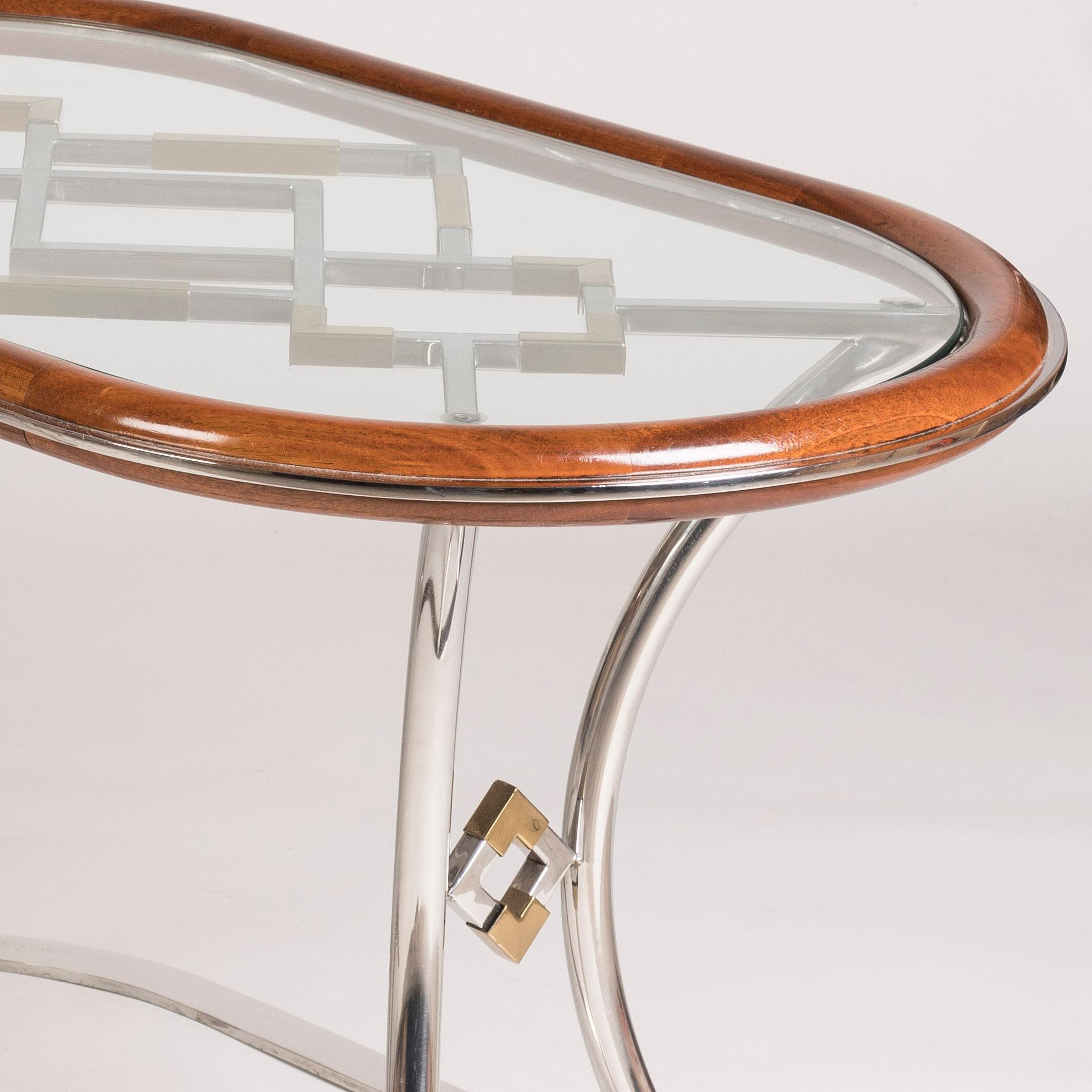 Laiton Paire de tables basses ovales modernistes françaises d'après-guerre attribuées à la Maison Jansen en vente