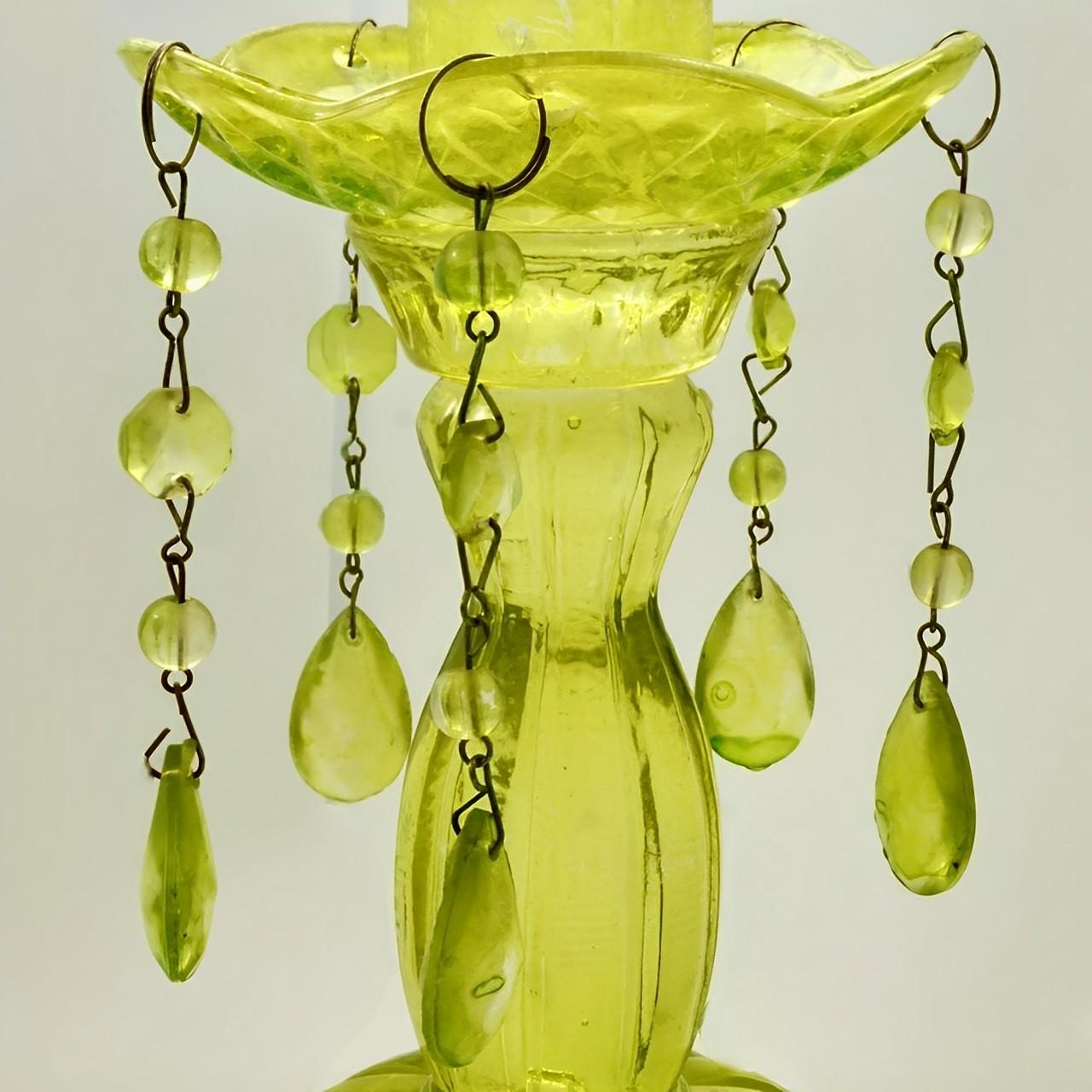 
Stylish pair of heavy chartreuse pressed glass French candlesticks with drops. They are height 16.5 cm / 6.5 inches, and the diameter of the base is 9.9 cm / 3.9 inches. One of the candle holders has some cracking, it is stable. We have given the