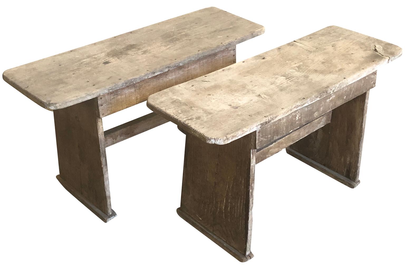 A very charming pair of small Primitive benches - small end tables from the Provence region of France constructed from naturally washed pine wood. Charming accent pieces for a casual interior.