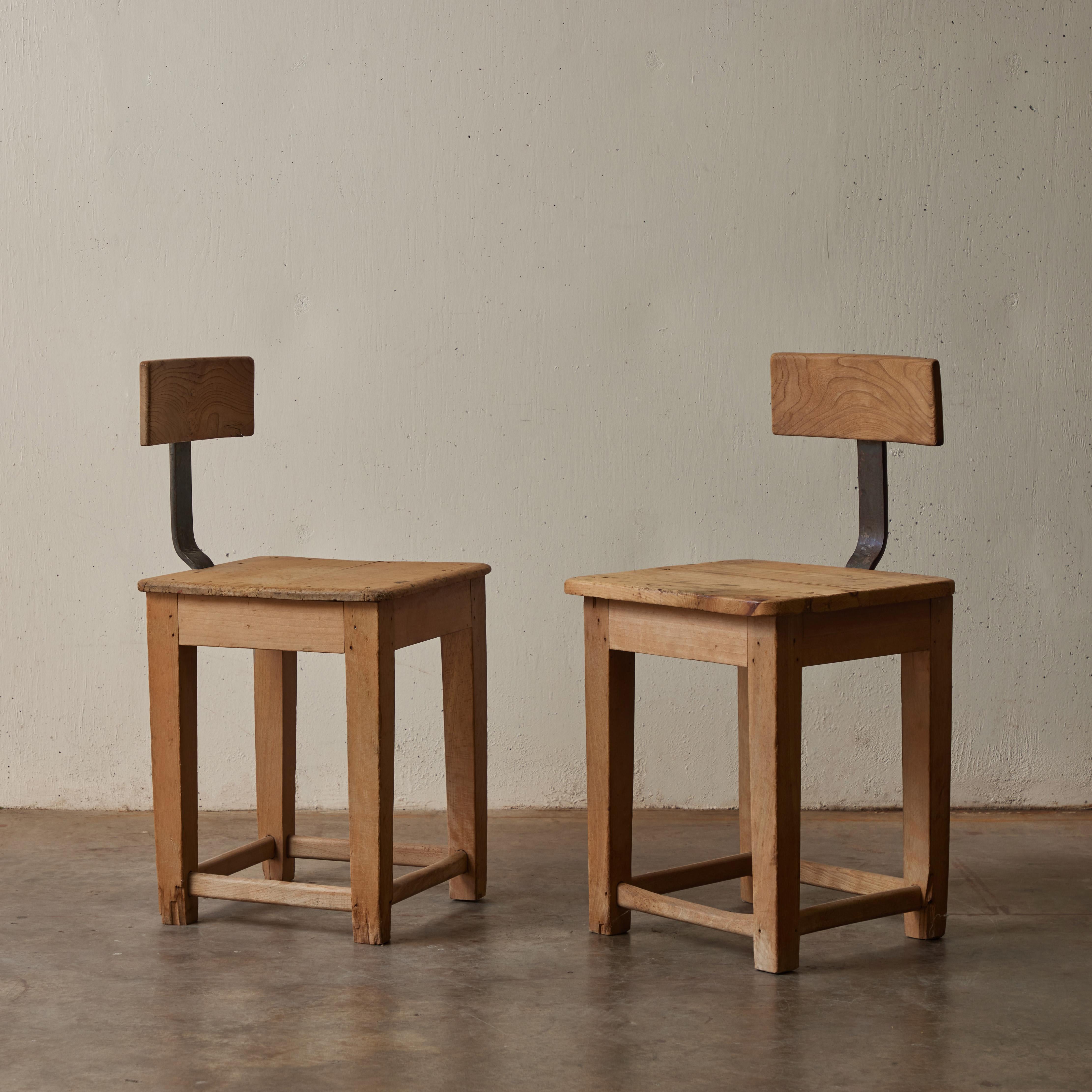 Pair of French Primitive Wood and Metal Industrial Chairs In Distressed Condition In Los Angeles, CA