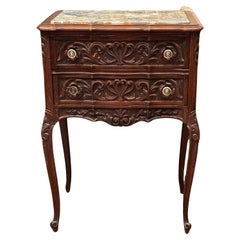 Pair of French Provincial Antique Marble Top Walnut Commodes.