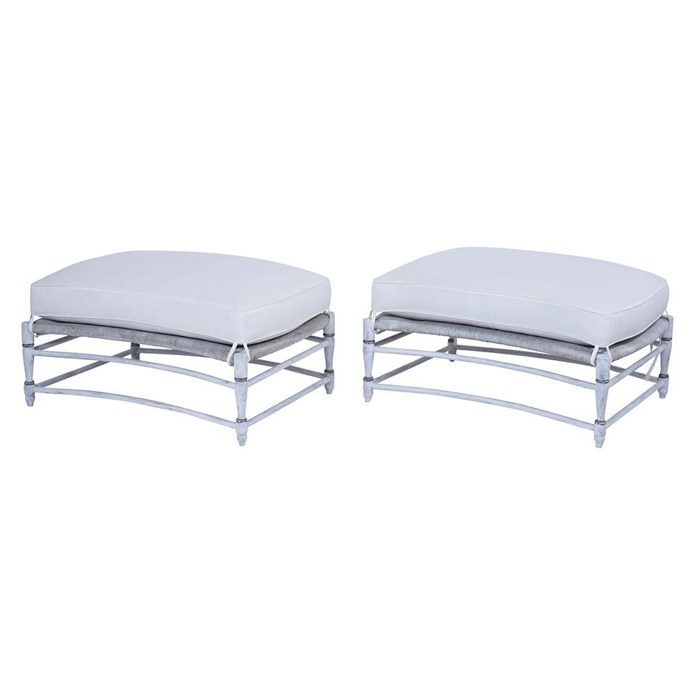 A unique pair of French rush seat benches crafted out of maple wood and are newly painted in off-white with blue color details combined with a distressed finish. These lovely pair of benches come with a comfortable removable cushion with a feather