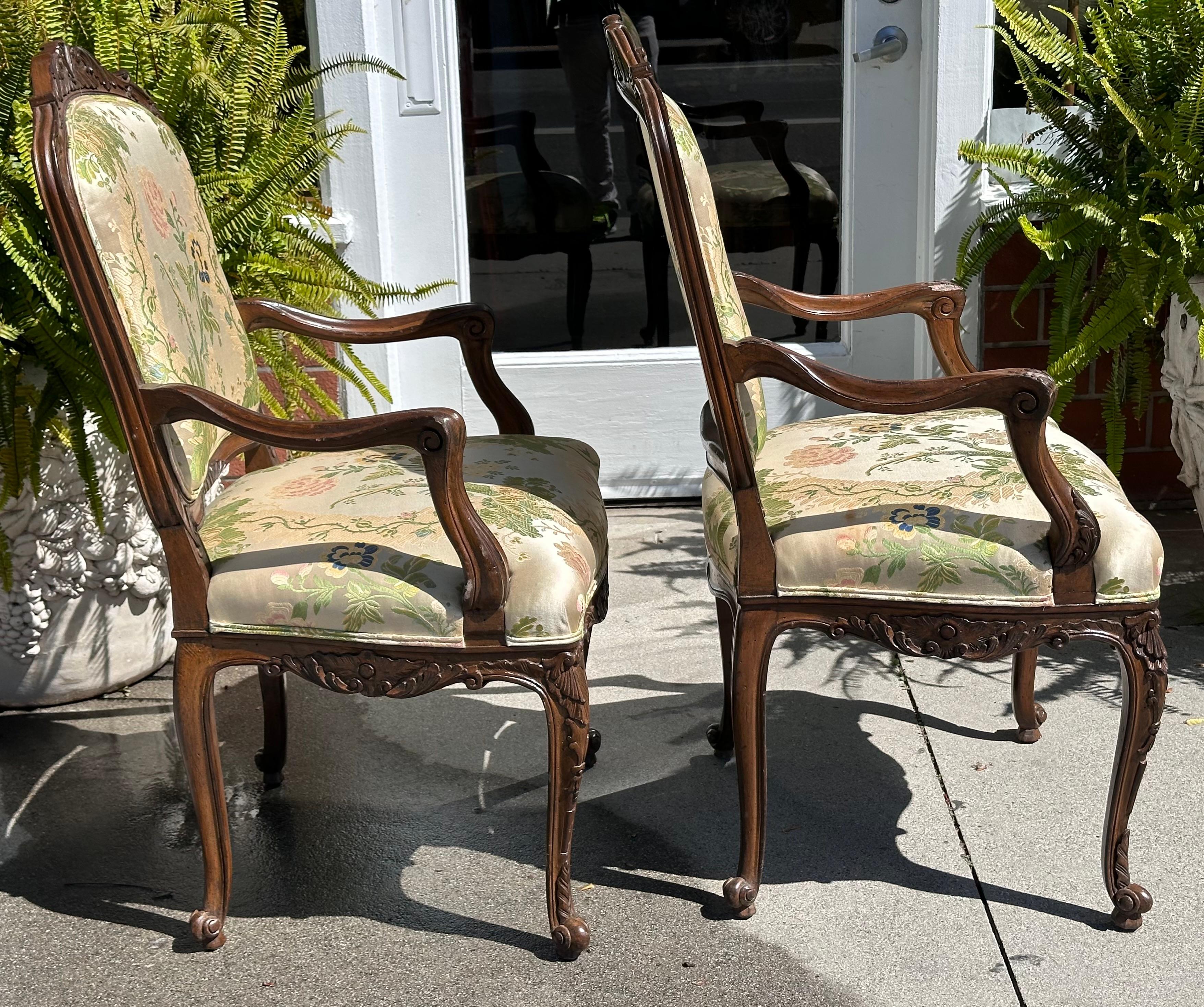 Pair of French Provincial Carved Walnut Chairs W Scalamandre Lampas In Good Condition For Sale In LOS ANGELES, CA