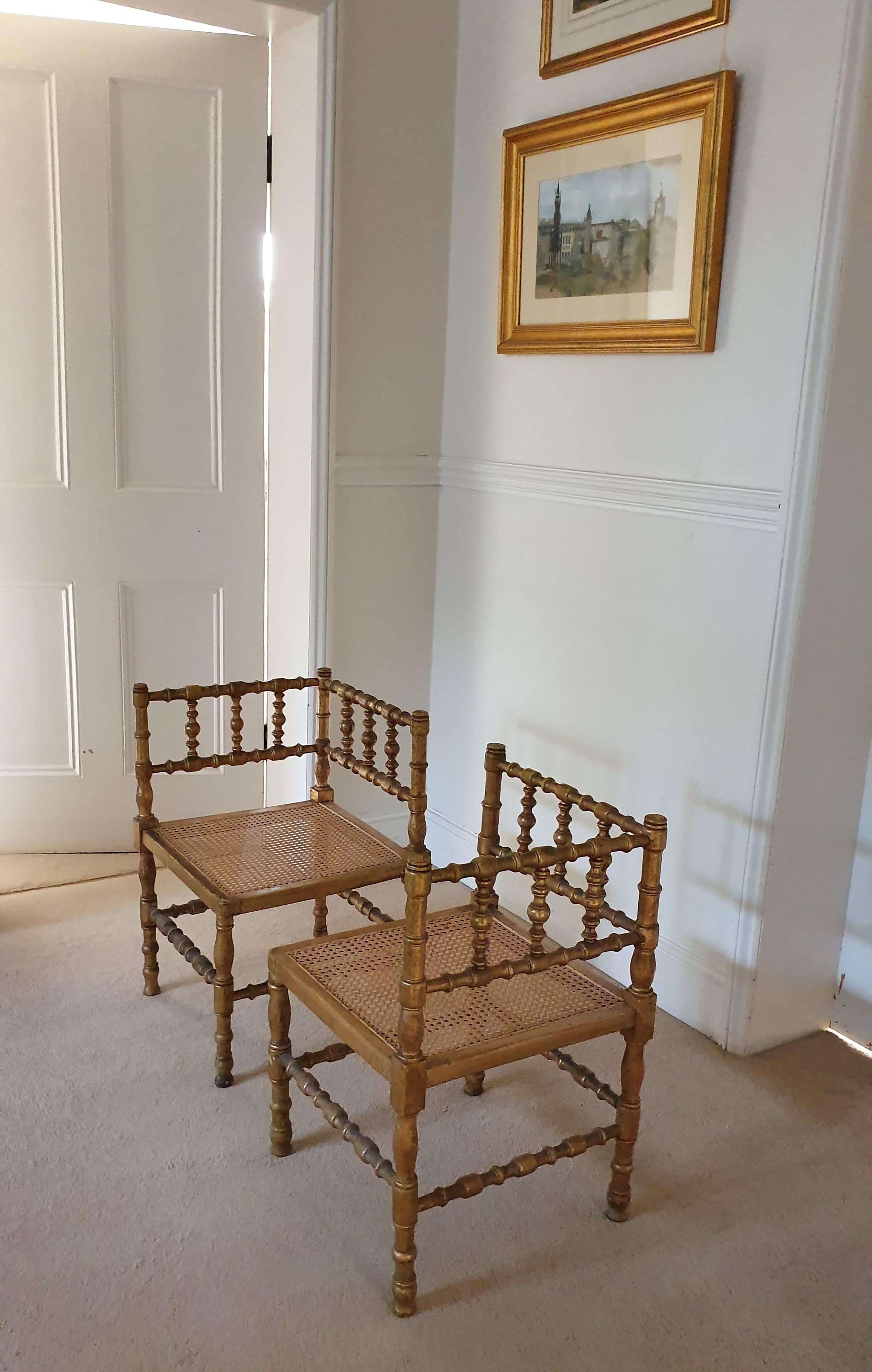 Pair of French Provincial Gilded Hand Carved Bobbin Chairs with Woven Cane Seats In Fair Condition For Sale In London, GB