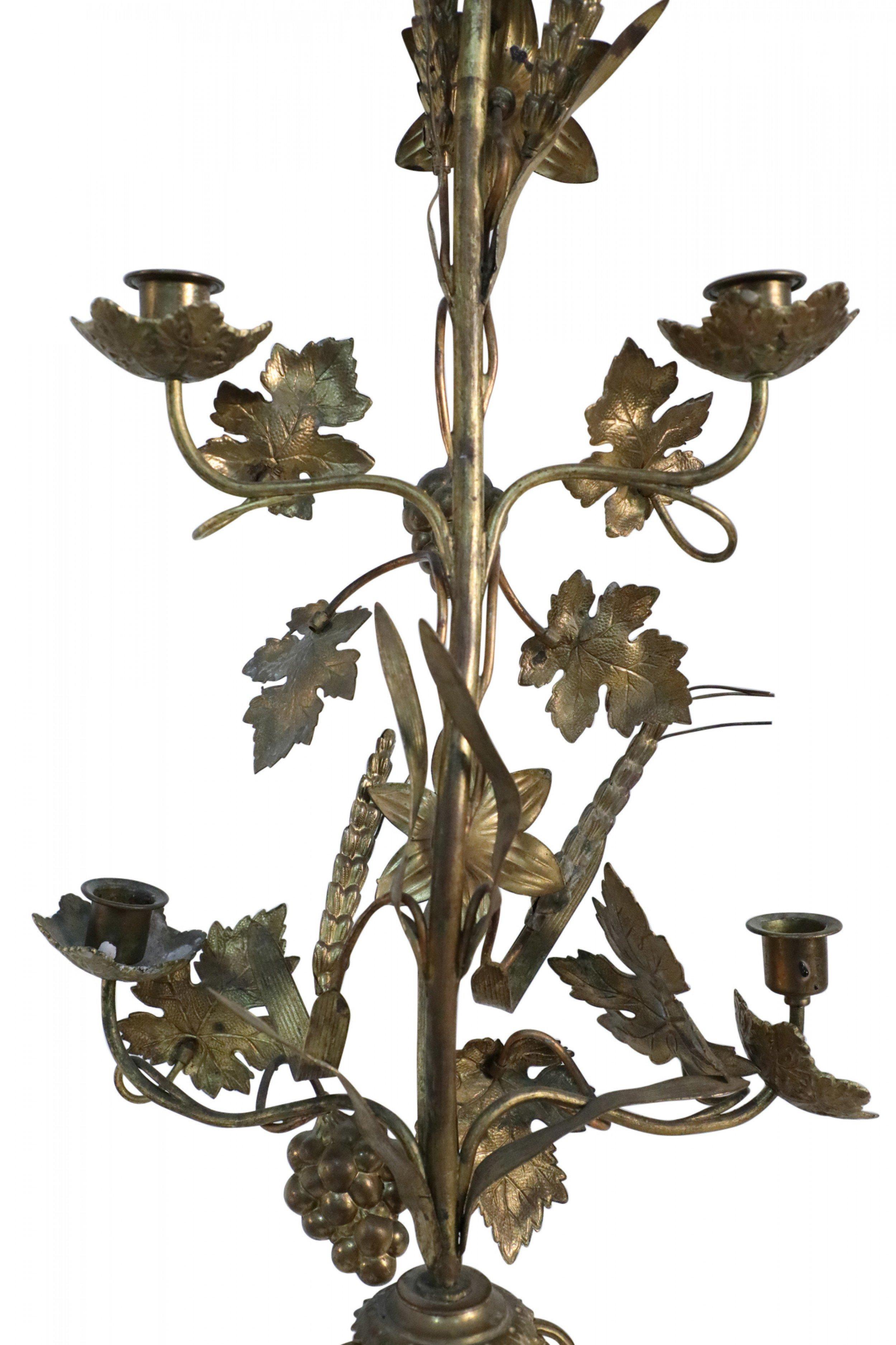 Pair of French Provincial bronze harvest motif 5-armcandelabras with decorative grape vines and leaves, wheat sheafs, and lilies intertwined above a triangular. (priced as pair)
 