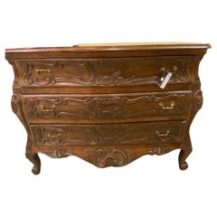 Pair of French provincial Louis XV-Style  Bombe’ walnut chest of drawers