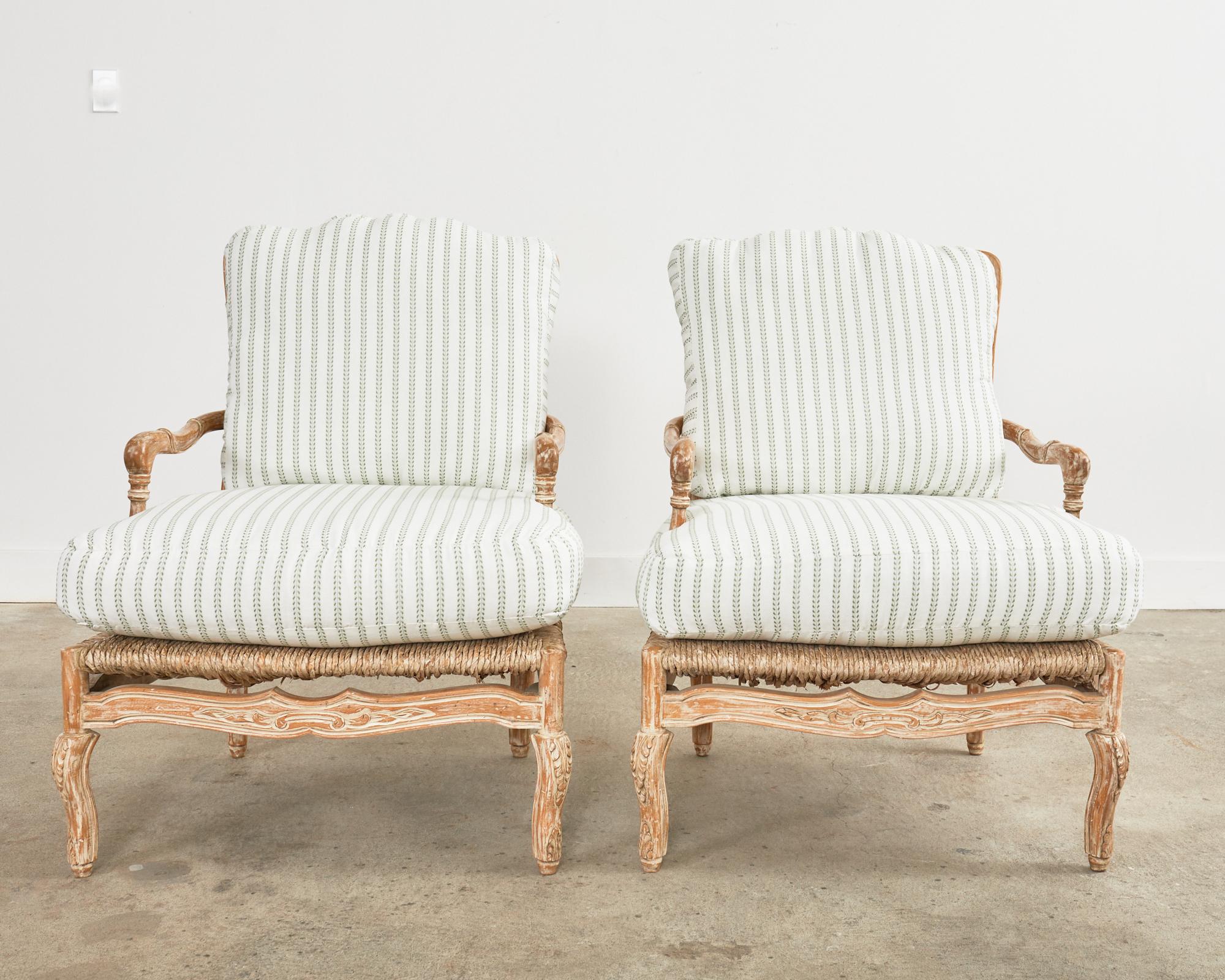 20th Century Pair of French Provincial Rush Seat Fauteuil Armchairs & Ottomans