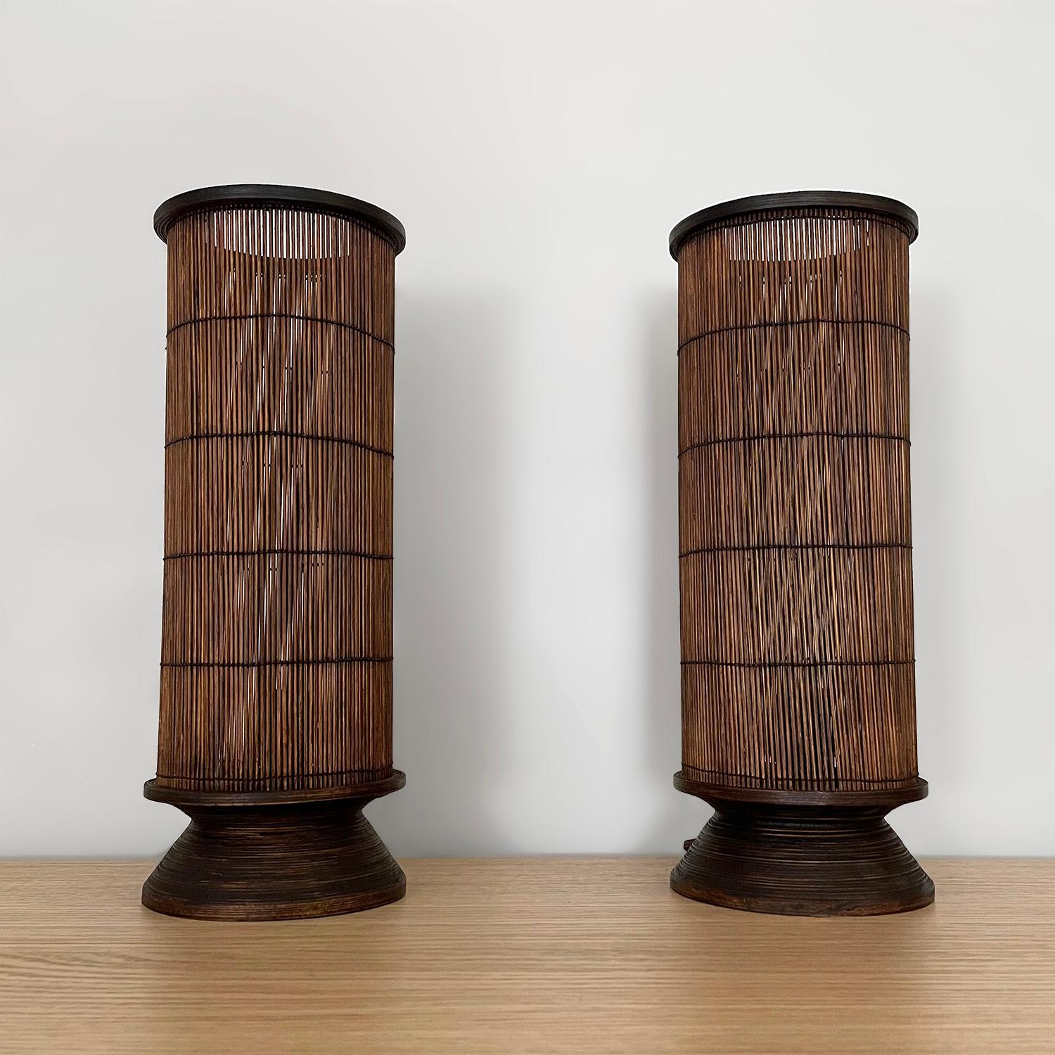 Pair of French rattan lamps
France, circa 1970’s
Cylindrical lamp shades are comprised of delicately woven reeds
Natural color variations
Organic composition and feel
Patina from age and use
Newly rewired
Single socket candelabra base
Priced and