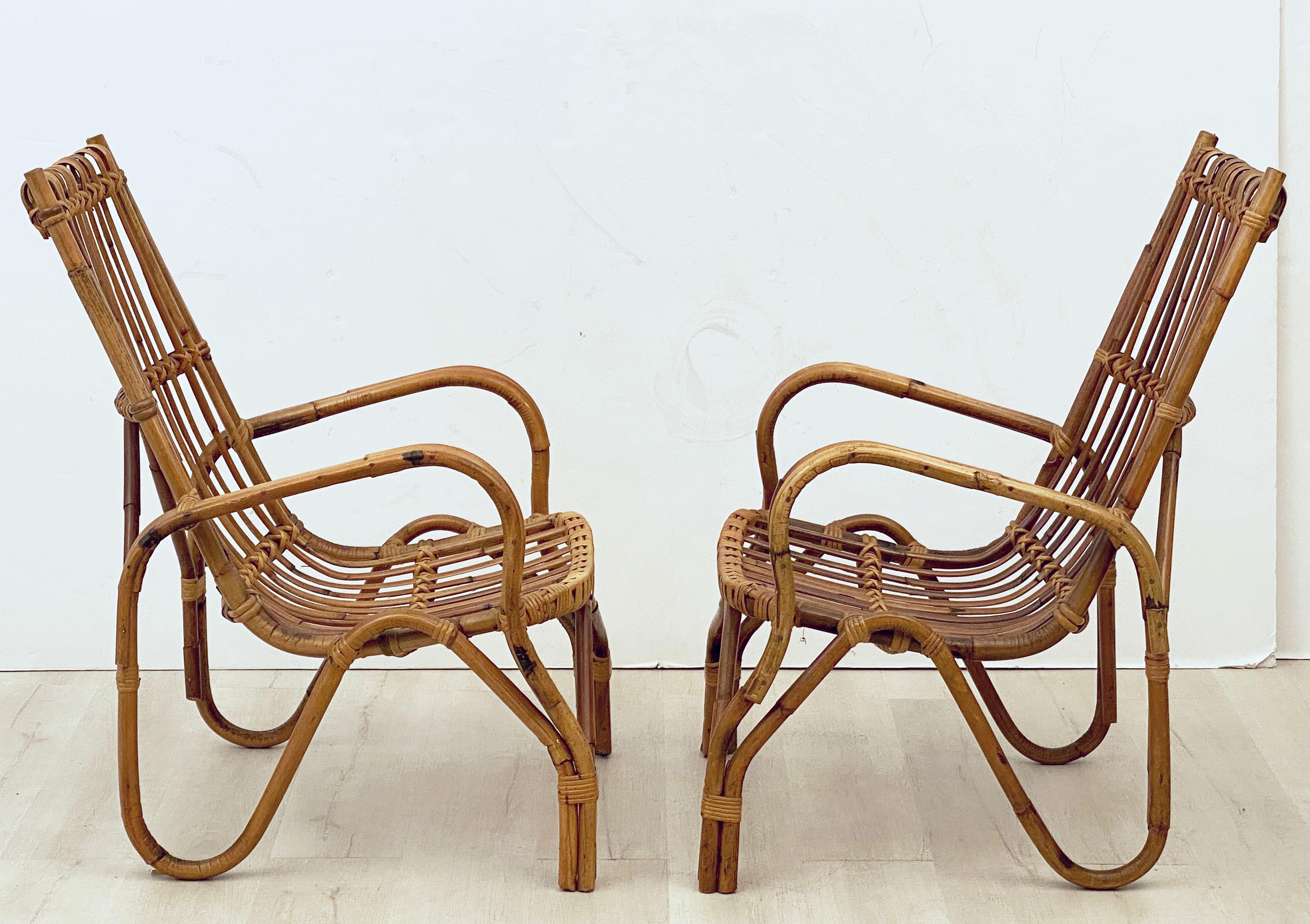 A fine pair of vintage French rattan lounge armchairs, each chair featuring a stylish design and comfortable seating.

Two available, individually priced, $2495 each chair.