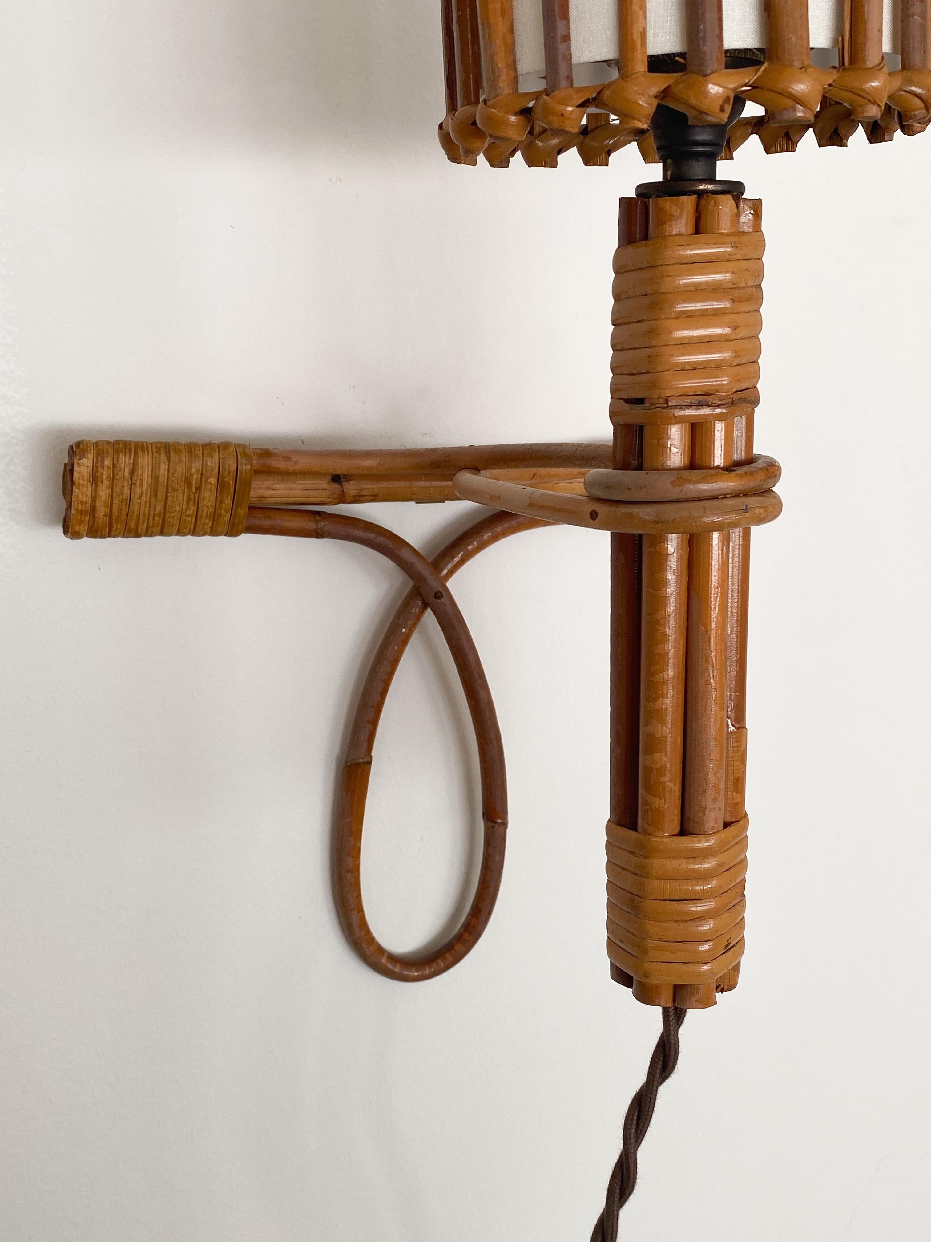 Mid-20th Century Pair of French Rattan Sconces by Louis Sognot