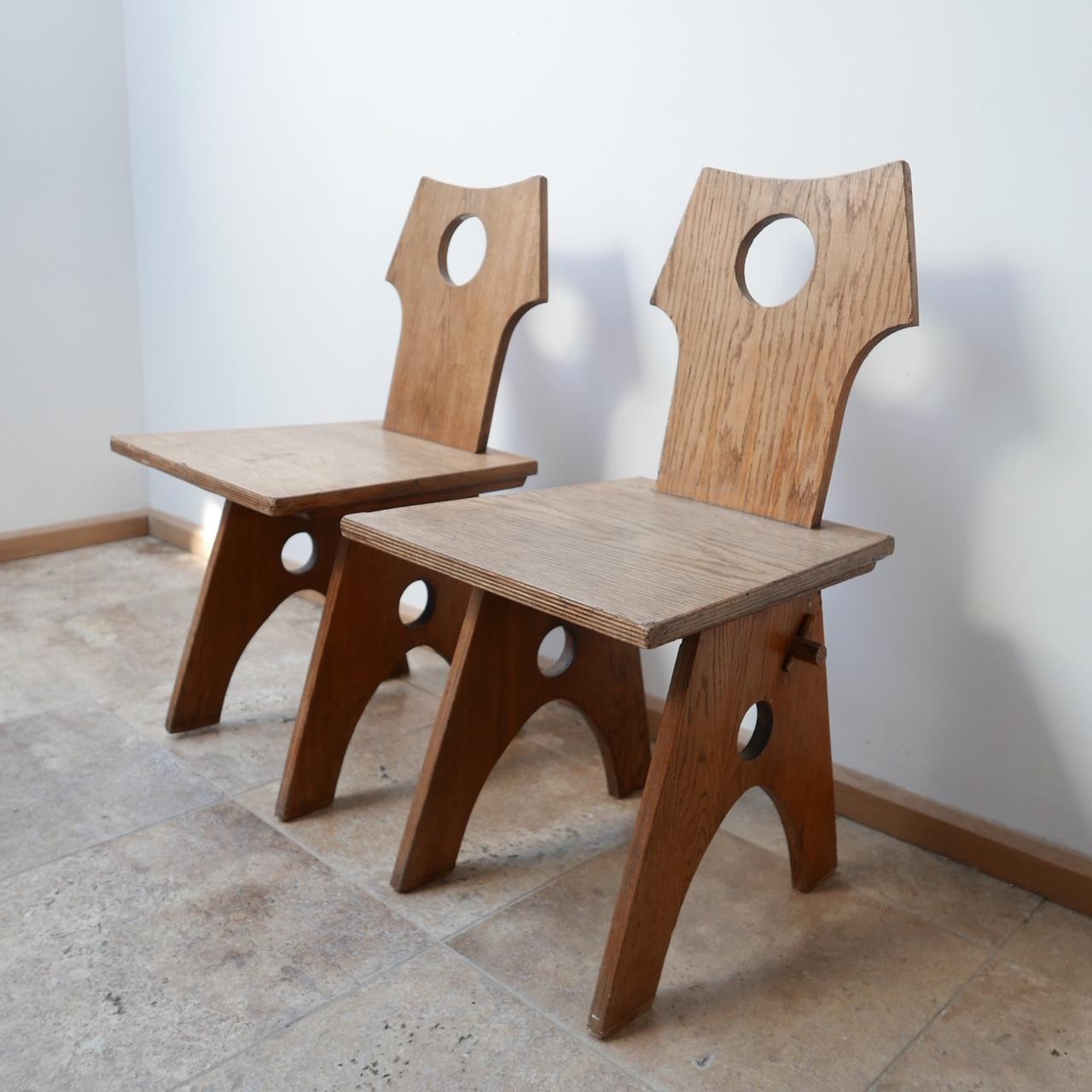 A pair of stylish occasional chairs. 

Re-construction period but with brutalist style elements. 

France, c1940s. 

They are small in size so perfect straddling a mantelpiece or in bedrooms. 

Dimensions: 40 width, 42 depth, 42 seat height,