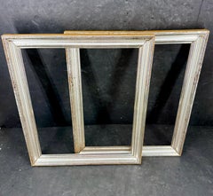 Paire de cadres d'art rectangulaires français en bois doré à la feuille d'argent