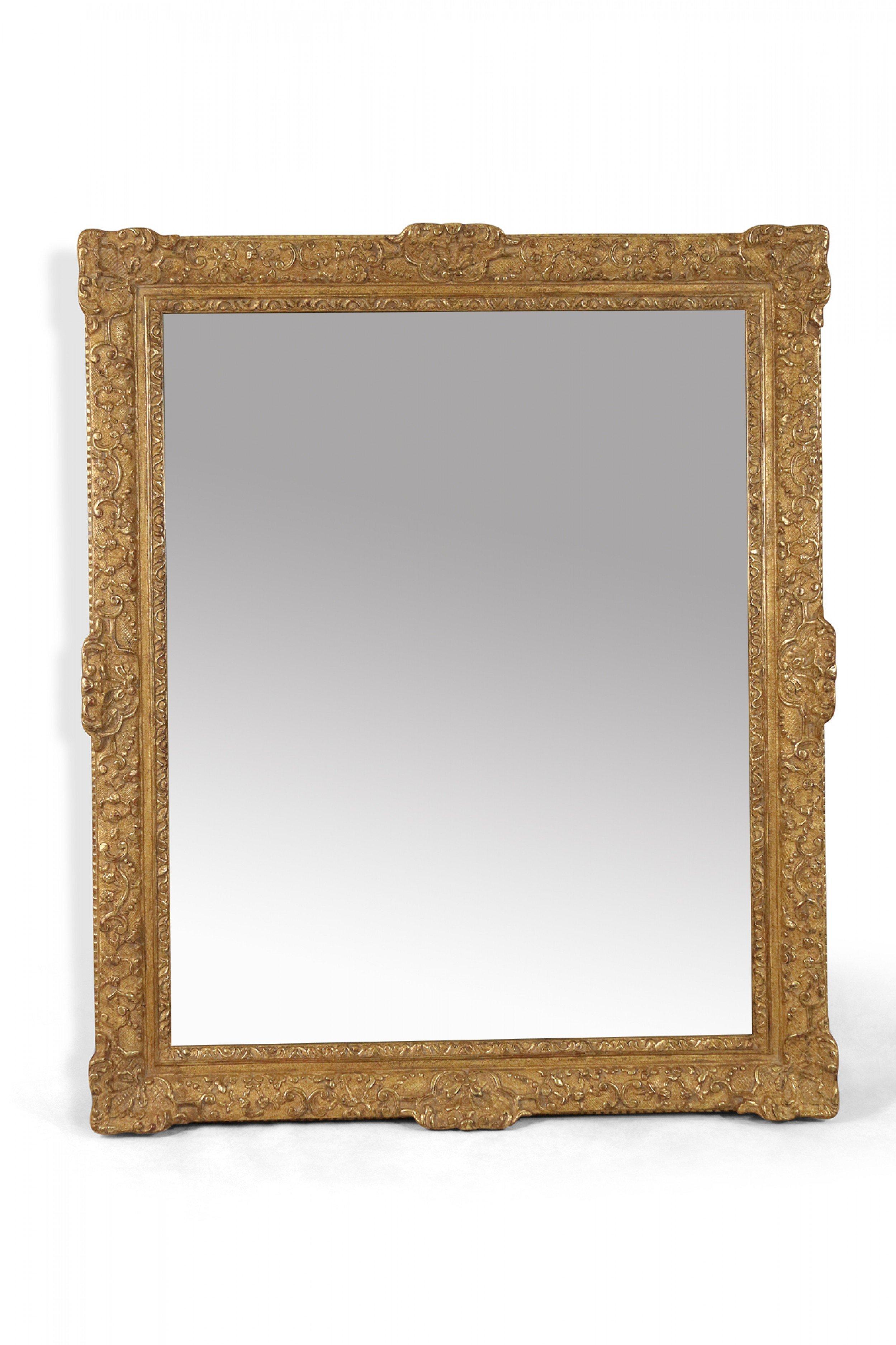 Pair of French Regence carved giltwood wall mirrors with large rectangular frames. (priced as pair)