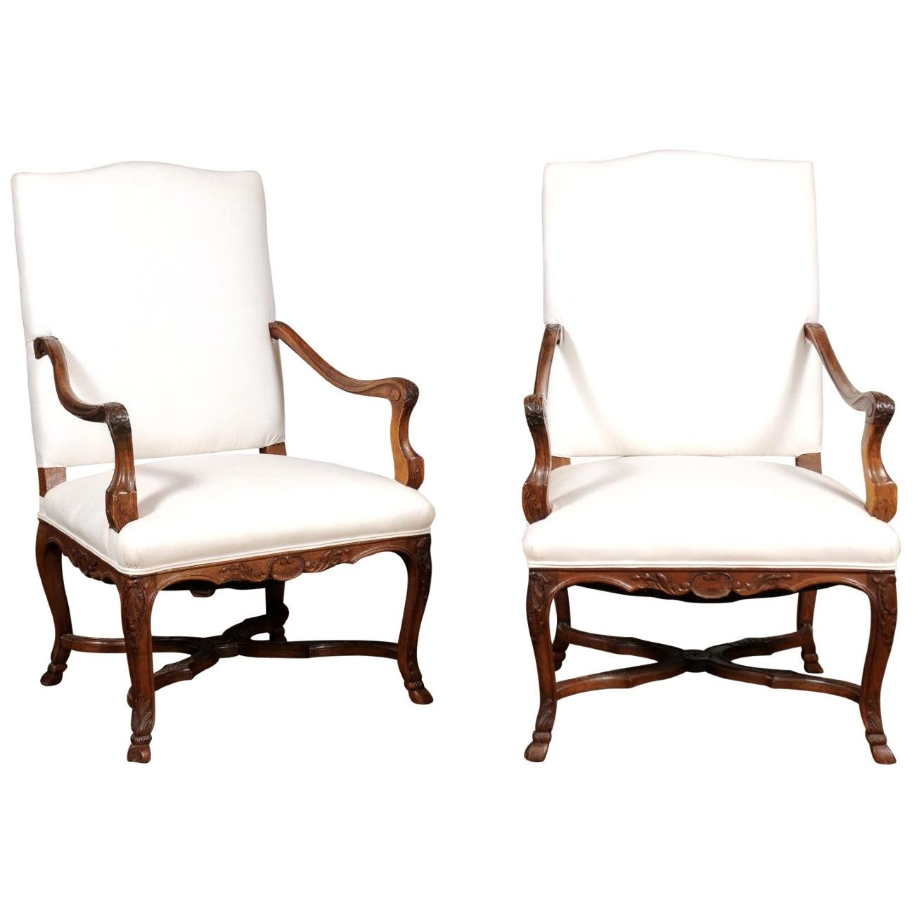 Pair of French Régence Style 19th Century Walnut Fauteuils with Carved Foliage