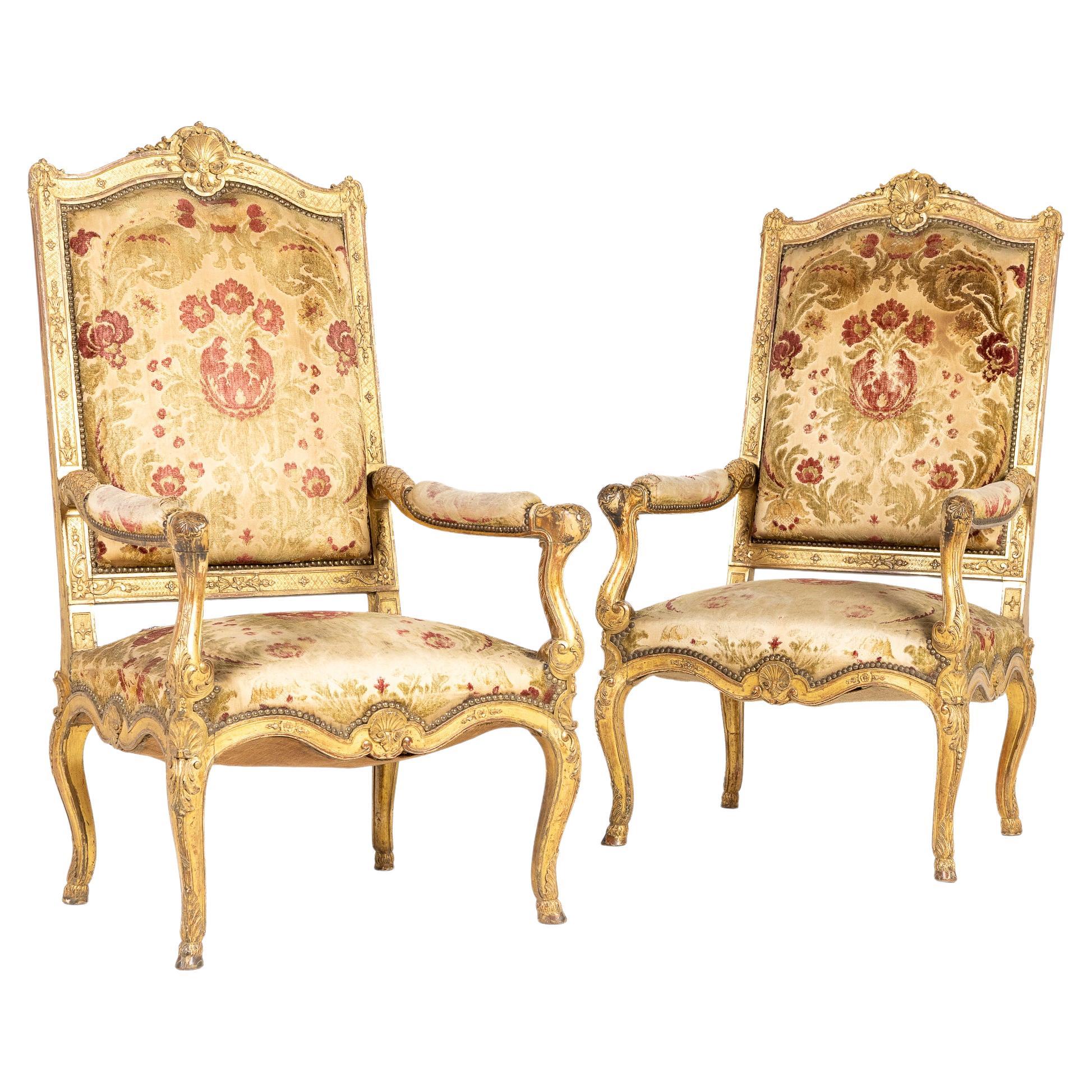 Pair of French Regence Style Giltwood Armchairs