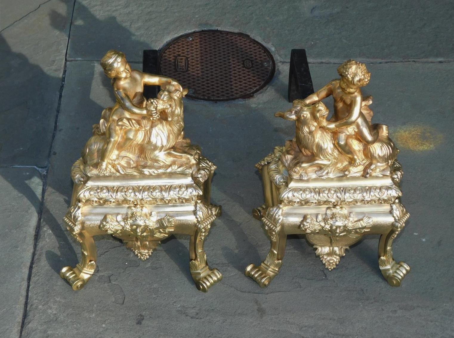 Hammered Pair of French Regency Gilt Bronze Figural Child & Goat Masked Andirons, C. 1725