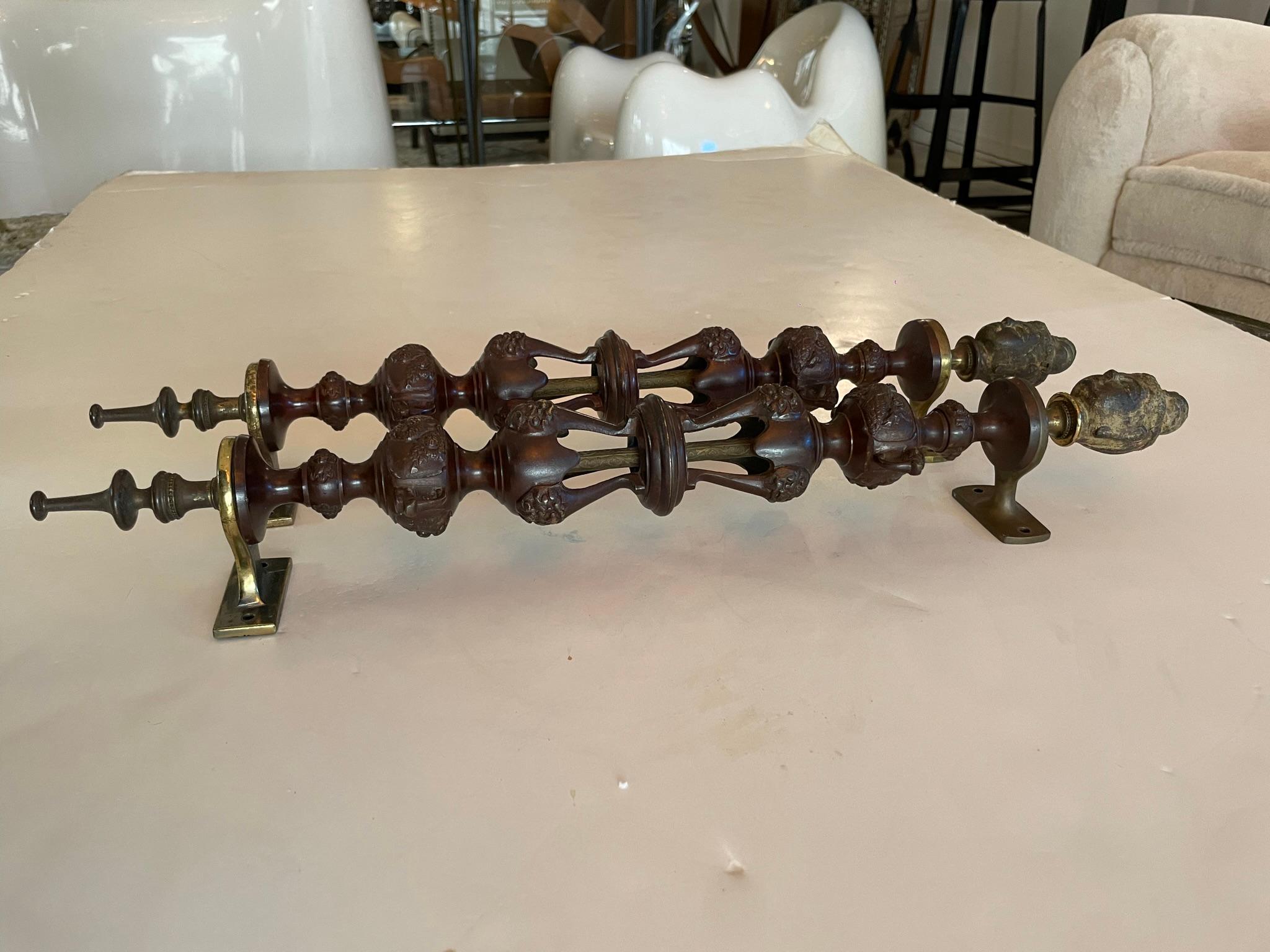 Incredible pair of 1920s French Renaissance handles, in bronze with brass mounting brackets.