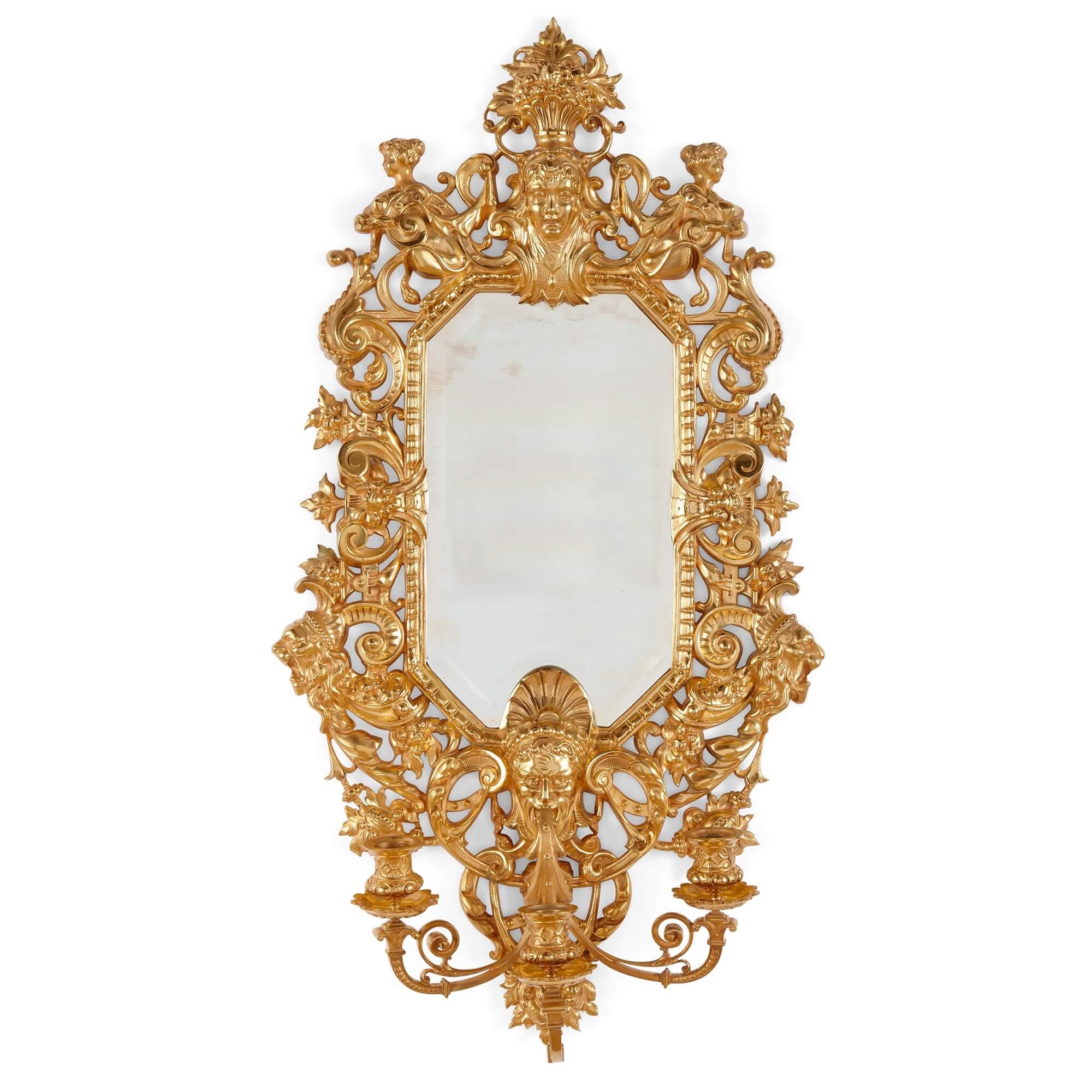 Pair of French Renaissance style Ormolu Wall Mirrors with Candelabra
French, 19th Century
Height 75cm, width 41cm, depth 16cm

Crafted from ormolu, or gilt bronze, in the charming and wonderfully eclectic Renaissance manner, this pair of mirrors is