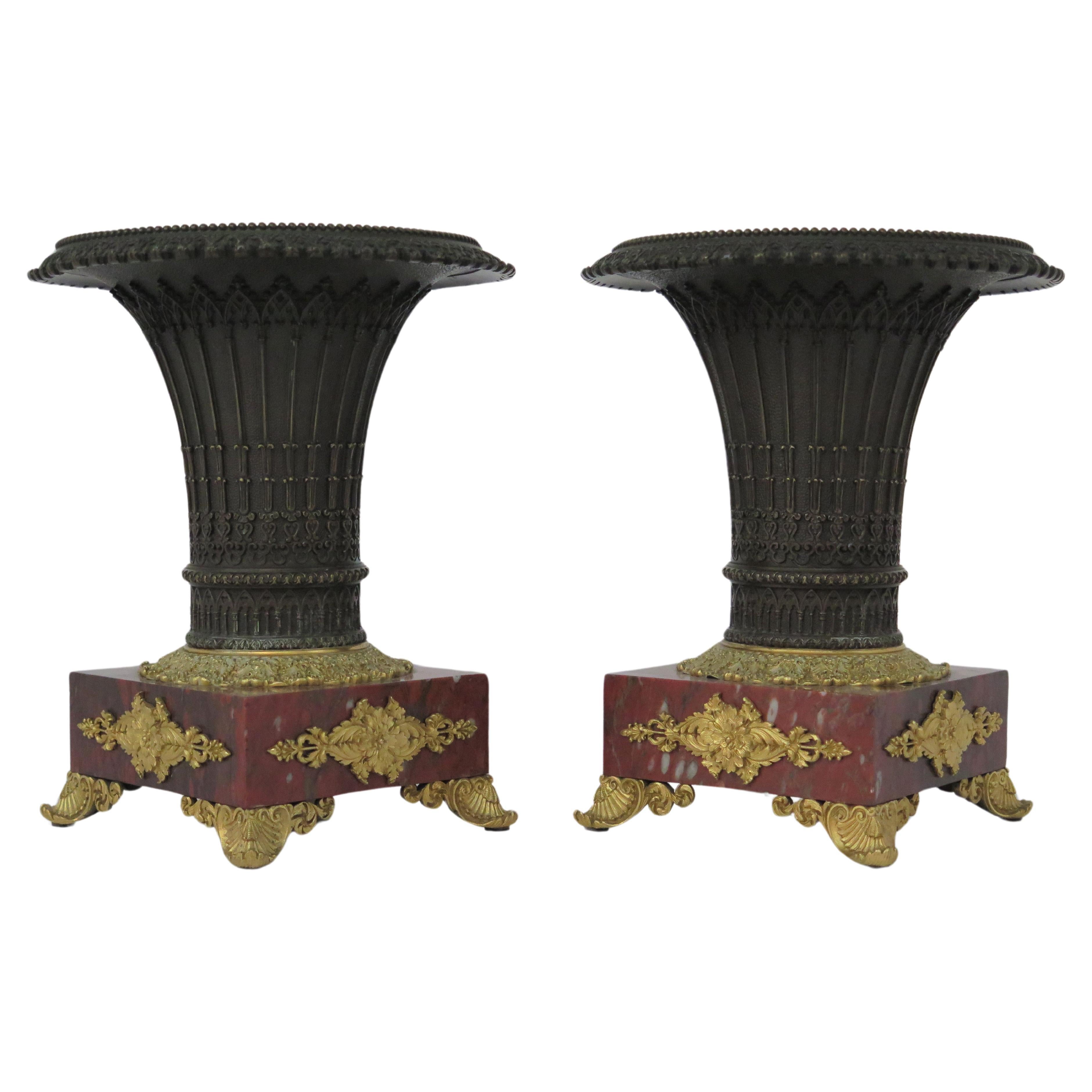 Pair of French Restoration Bronze Urns with Rouge Gritte Marble and Ormolu
