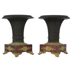 Pair of French Restoration Bronze Urns with Rouge Gritte Marble and Ormolu