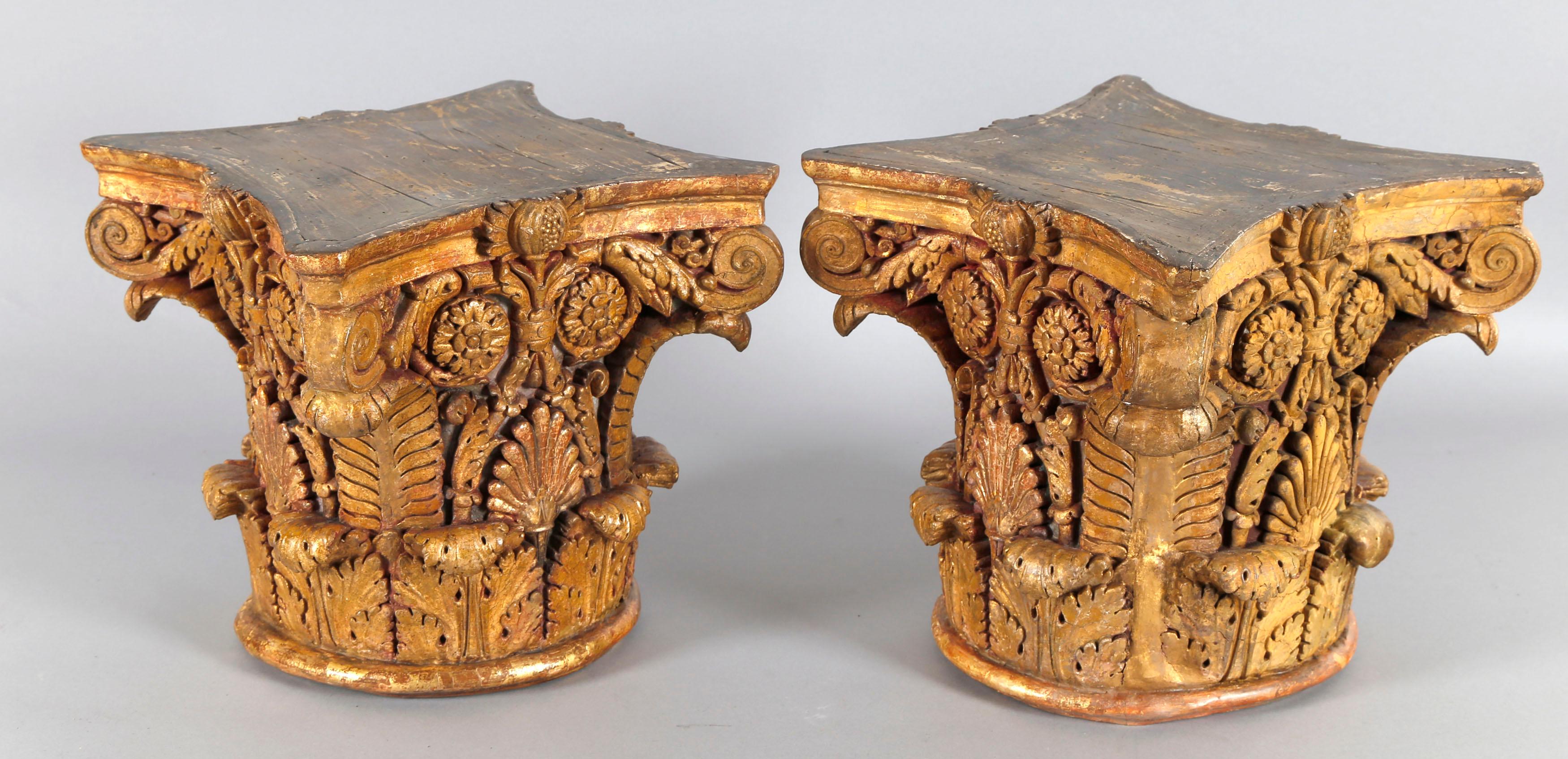 A pair of French richly carved, circa 1790 Corinthian capitals. Beautiful details and excellent condition of the gilding. Louis XVI, France, circa 1790. 

Place these on top of simple white square pedestals for a richly layered yet minimal look.