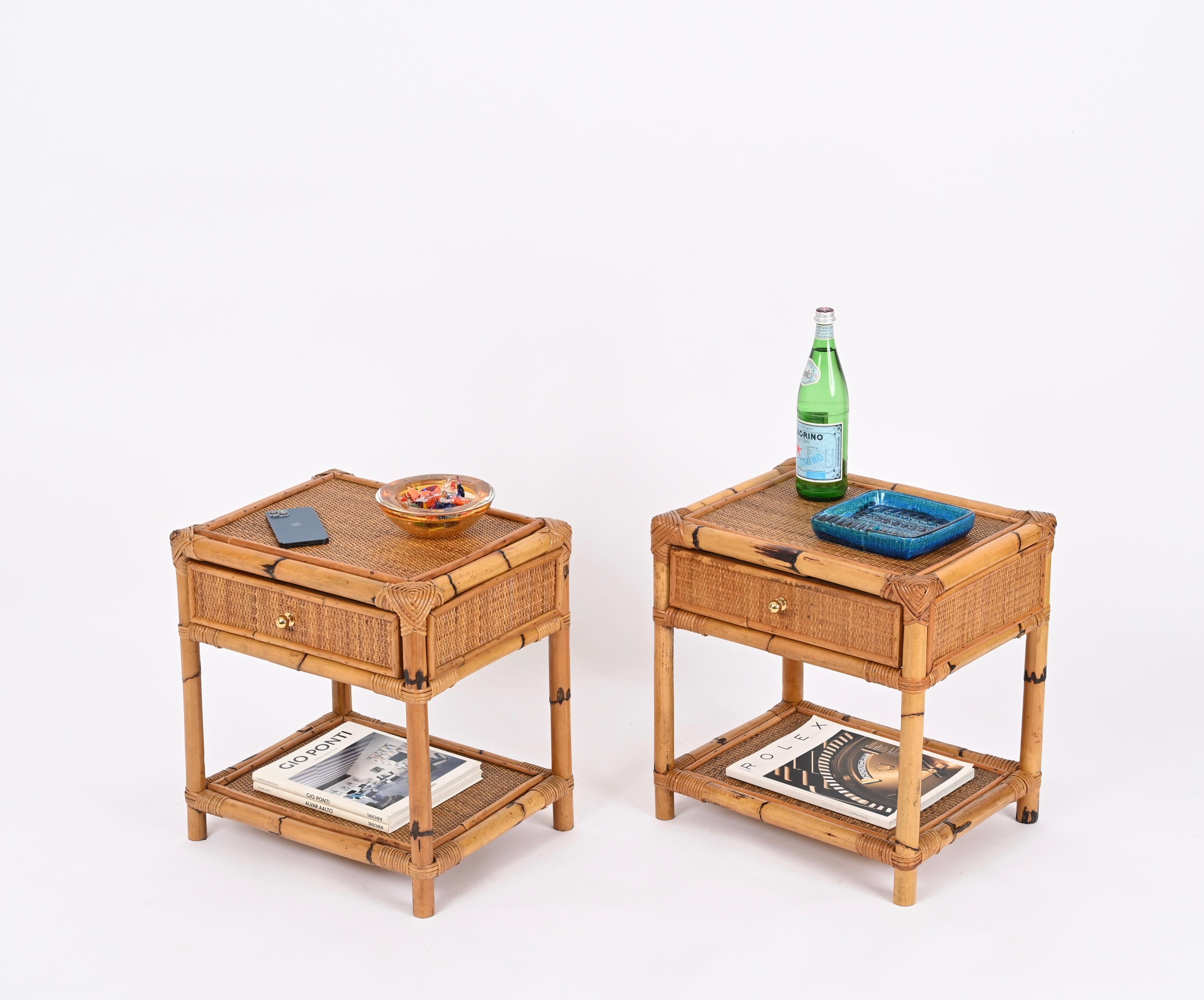 Fantastic pair of Mid-Century nightstands in bamboo, hand-woven rattan wicker and brass handles. These lovely bedside tables were designed in Italy during the 1970s.

These charming nightstands are fully made in bamboo canes and enriched all around