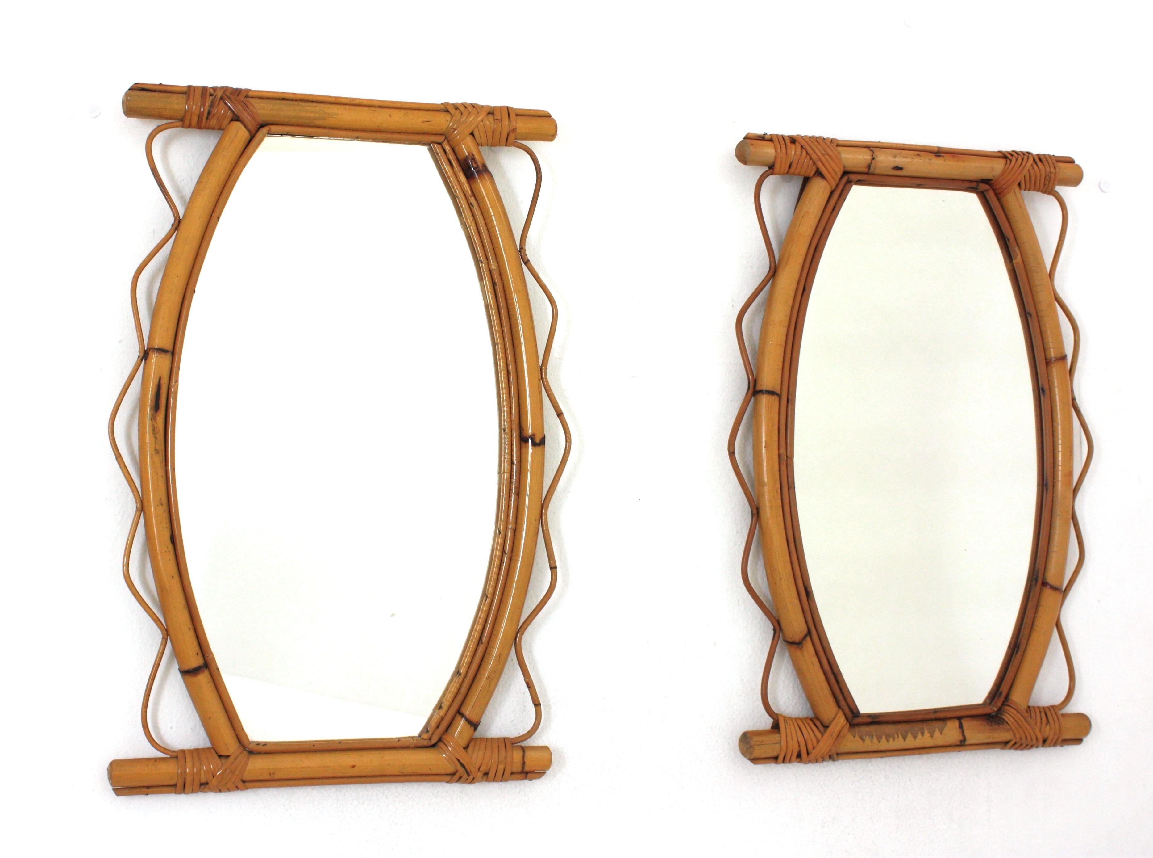 Eye-catching handcrafted bamboo and rattan mirrors with scalloped detail surrounding the frame. France, 1950s-1960s.
This pair of Mediterranean wall mirrors feature a bamboo / thick rattan frame surrounded by jagged rattan accents on both sides.