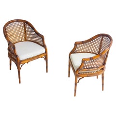 Pair of French Riviera style faux bamboo lounge chairs in wicker, 1980s