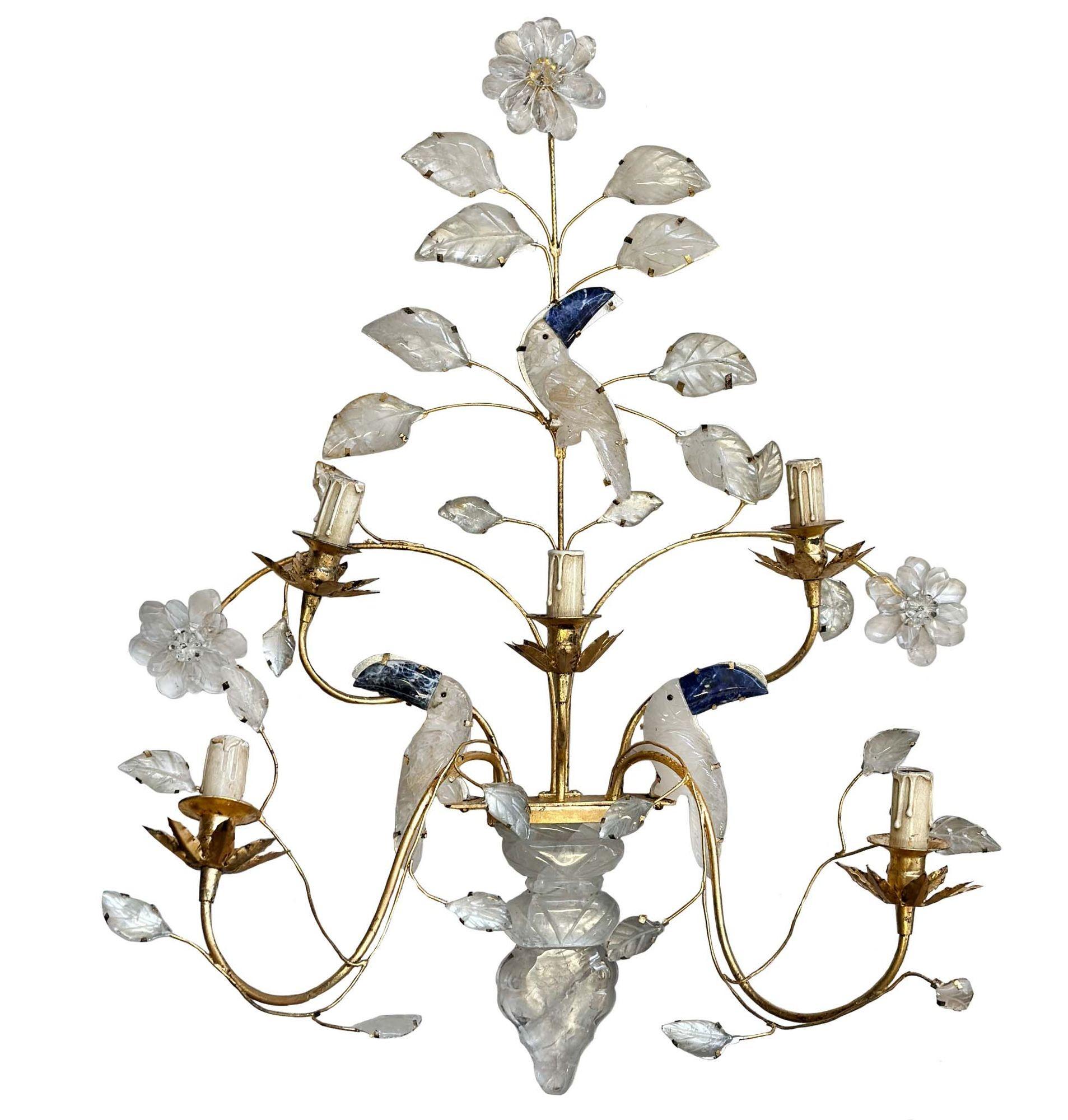 Pair of elegant rock crystal and lapis lazuli stone sconces with toucan and flower figures. Includes five candelabra socket lights. Made in France, c. 1950's.
Dimensions:
32