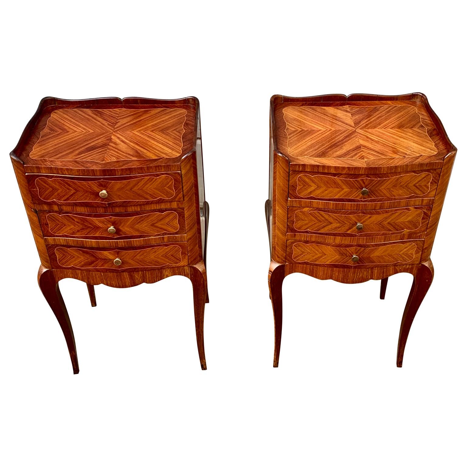 A pair of French Mid-Century nightstands or small chest of drawers in mahogany veneer with 3 drawers that can be used as bedside commodes- The pair is 