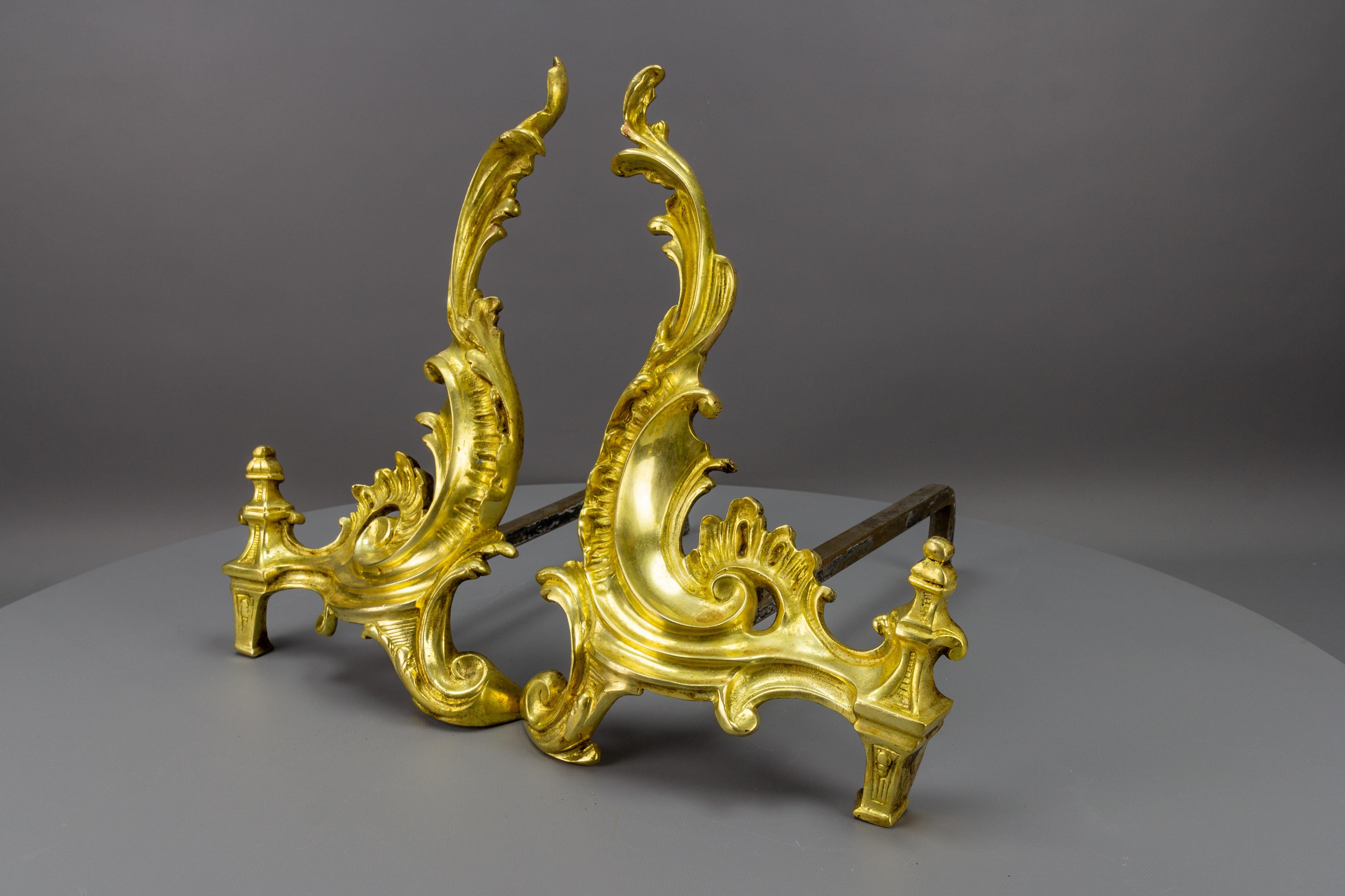 Louis XV Pair of French Rococo Style Gilt Bronze and Iron Firedogs, Early 20th Century For Sale