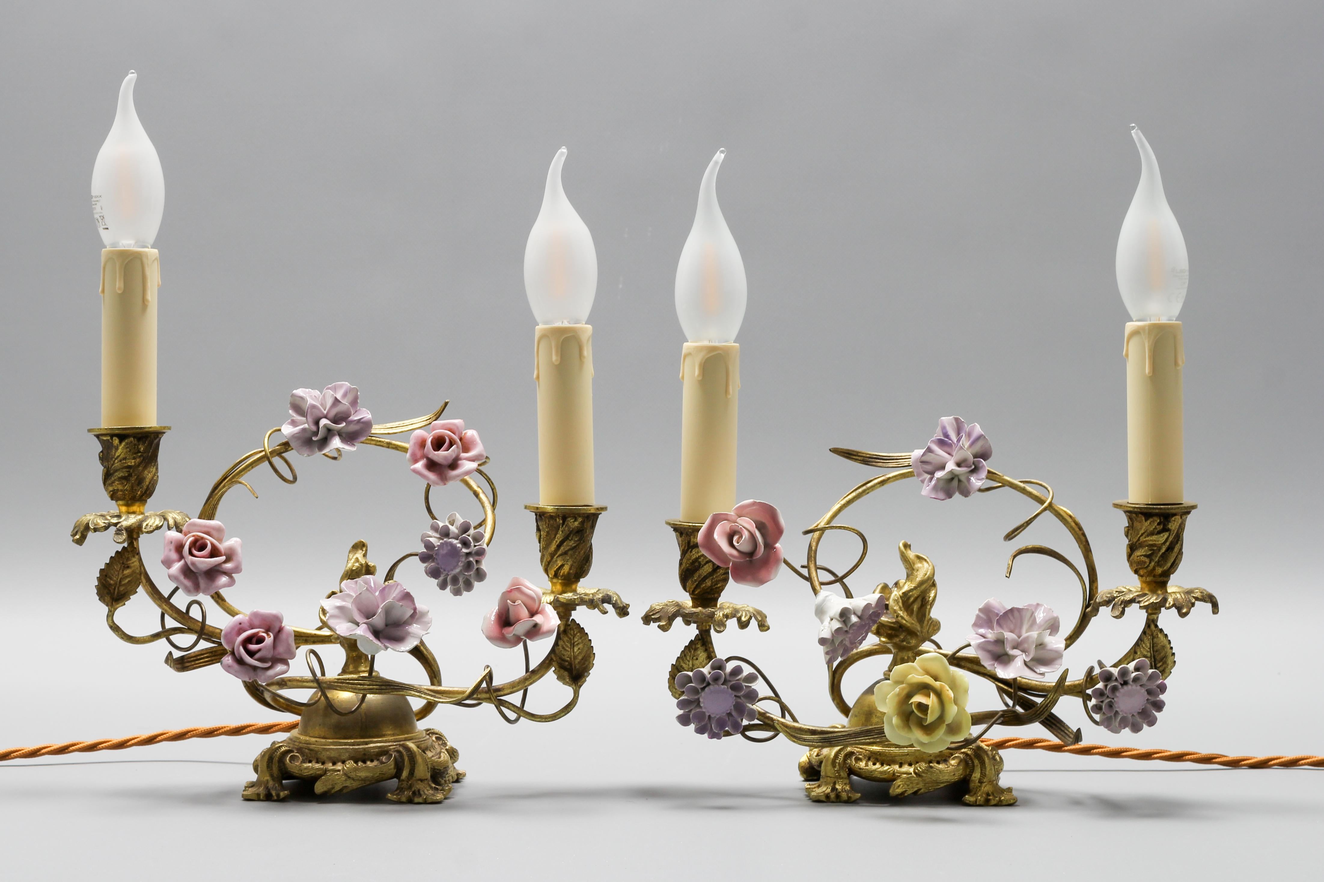Pair of French Rococo style gilt bronze and porcelain flower table lamps.
This absolutely adorable pair of French Rococo-style two-light table lamps are made of gilt bronze and are surrounded by foliate decors and have an ornate round foliate bronze