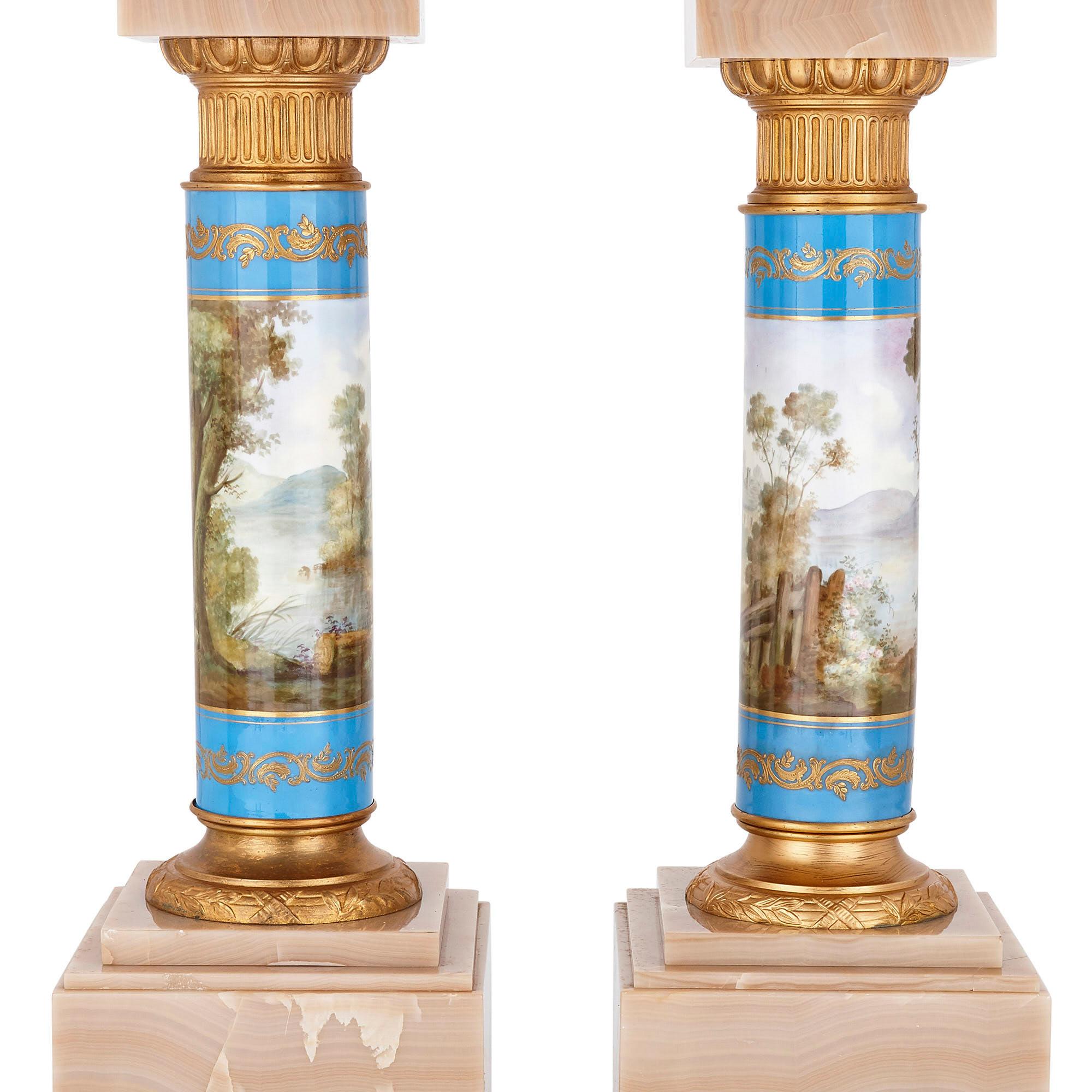 Pair of French Rococo style onyx and porcelain pedestals
French, c. 1900
Height 83cm, width 32cm, depth 32cm

Each pedestal in this pair features a veined onyx plinth-form base and a stepped onyx top. The base and top are connected by an