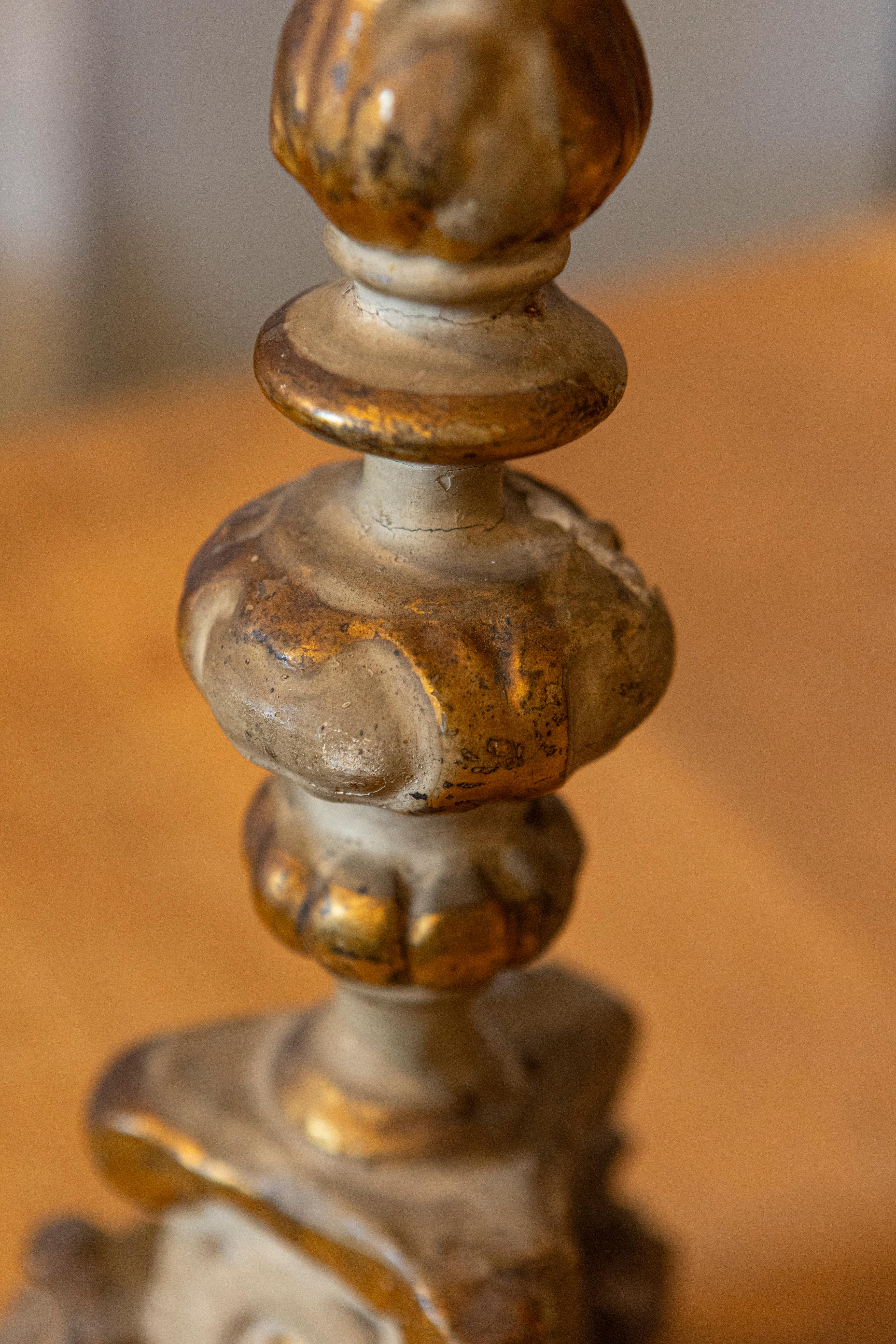 Wood Pair of French Rococo Style Parcel Gilt Candlesticks with Carved Lion Paw Feet