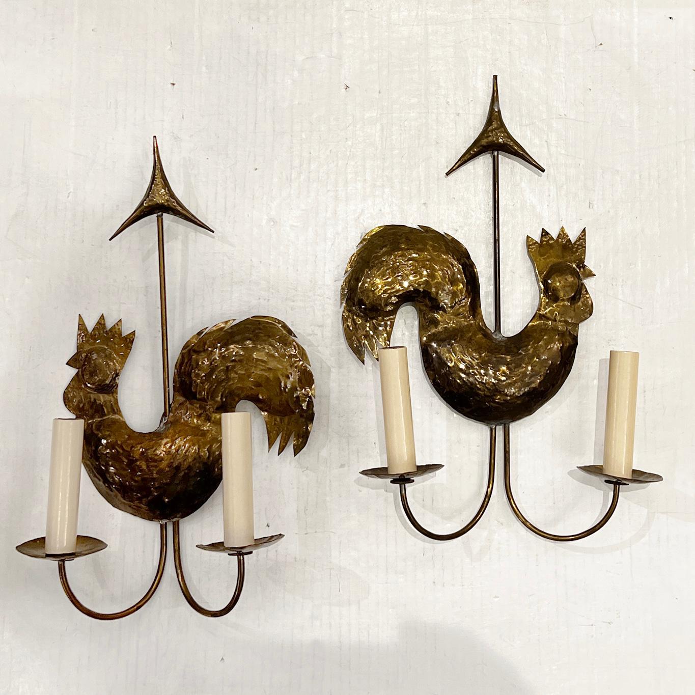 A pair of French circa 1960's hammered brass rooster sconces with original patina.

Measurements:
Height: 15