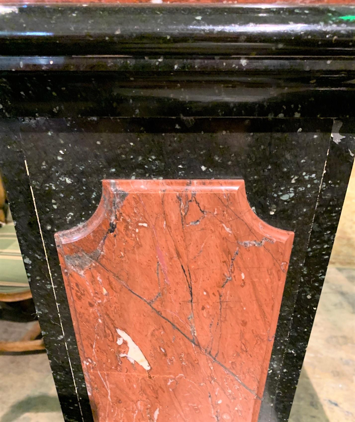 Fabulous pair of early 20th century French tapered pedestals in colors of speckled ebony and rouge red, circa 1920. 10 x 10 tops, midsections are 13 x 13, and bases are 13 x 13, 50.5 high.