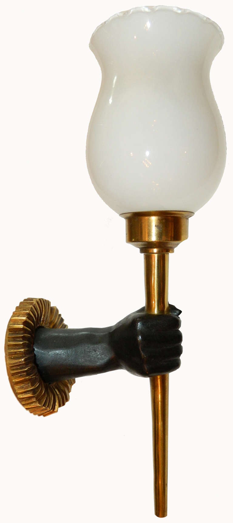 Pair of brass sconces handling a torch by John Devoluy.
60w each.
Provenance: Parisian hotel
US wired and in working condition.
Original patina
Have a look on our impressive collection of French and Italian midcentury period Sconces. More than 200