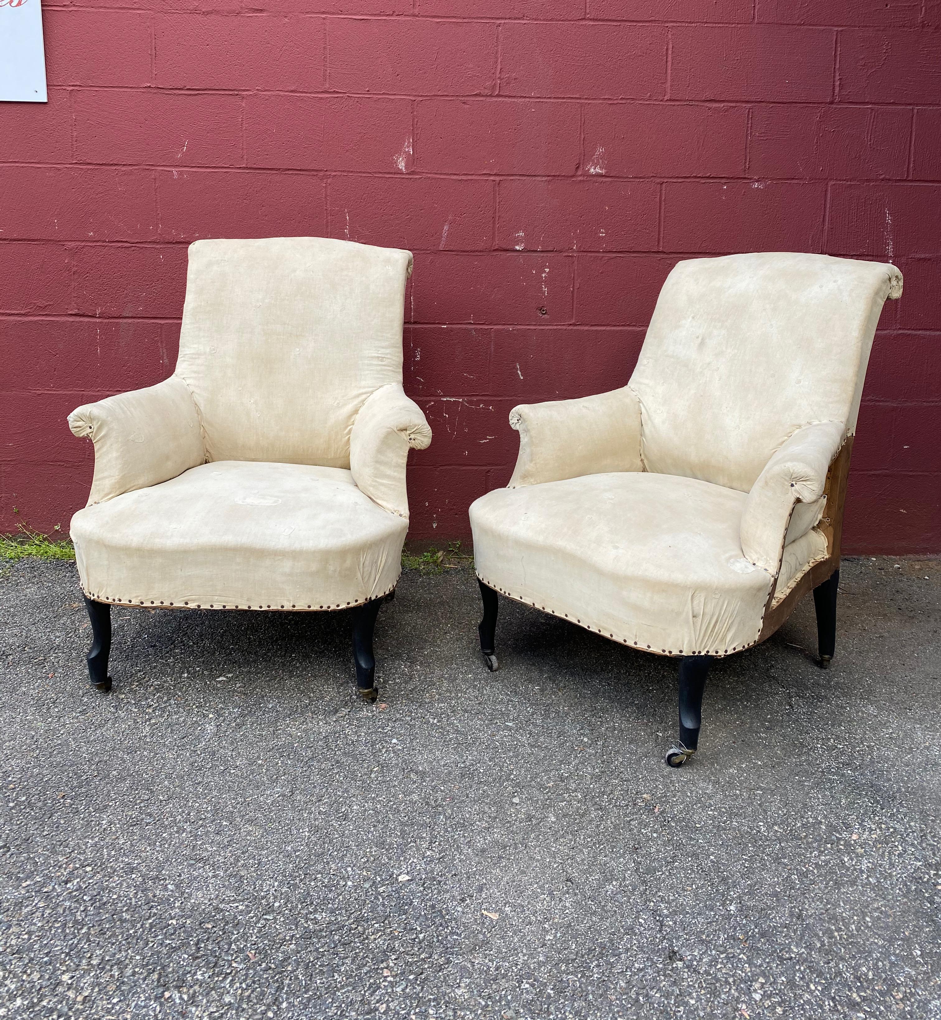 A pair of French 19th century Napoleon III armchairs with very stylish scrolled backs and arms. The chairs have been stripped down to the muslin and are ready to be upholstered. Sold as is 

French, circa 1880.
 
